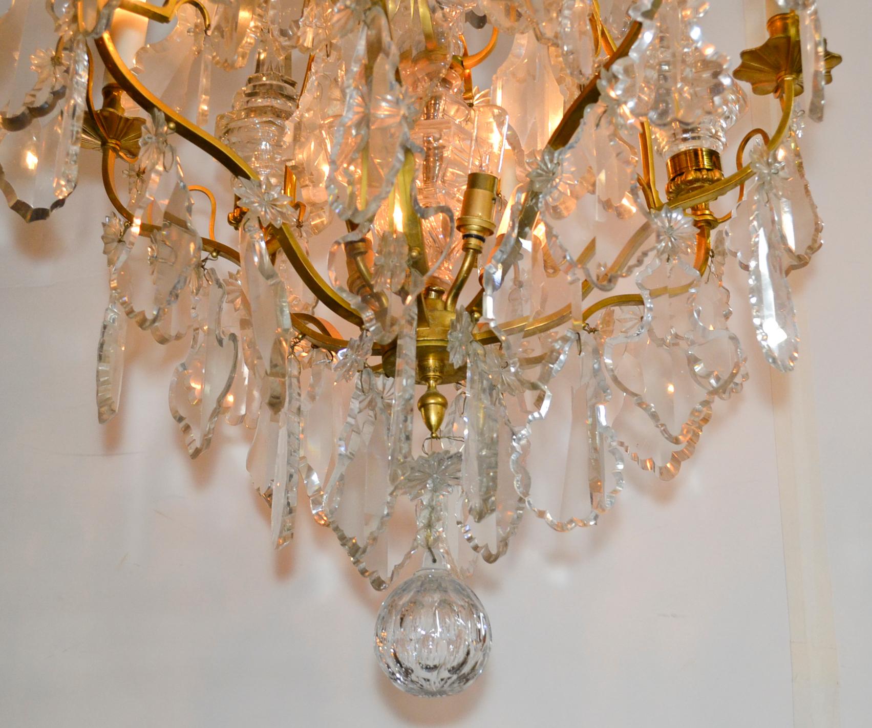 Great antique French gilt bronze and crystal chandelier.  Attributed to baccarat.   Best dore’ bronze finish you will find and exceptional quality crystal and spears.   Hard to find quality!   Cleaned and re-wired, ready to hang!