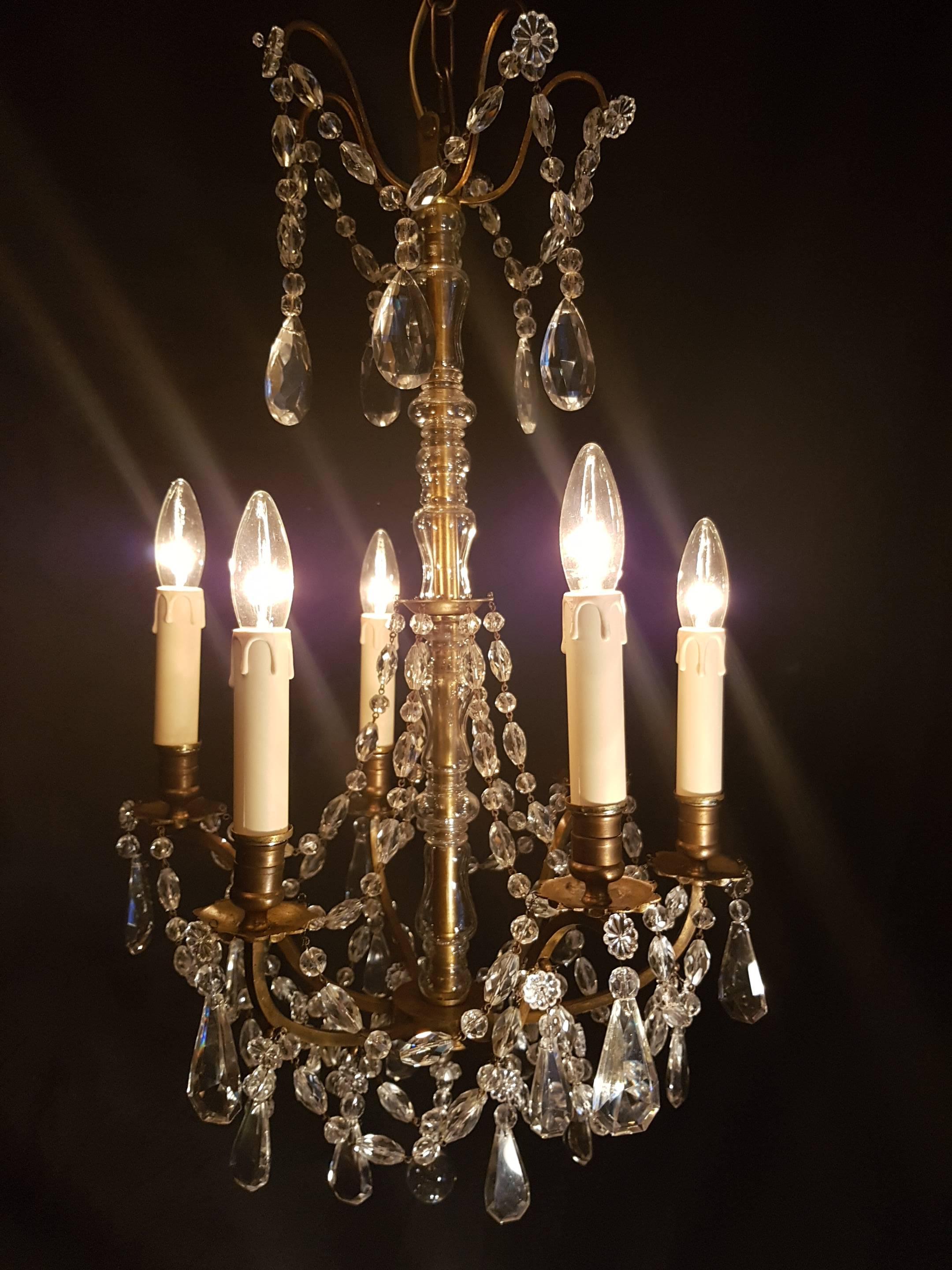 French bronze chandelier with crystals and strings of beads. Very nice small and delicate bronze chandelier with six candle lights. 

Due to the size of the chandelier it is relatively cheap to send the chandelier.

 