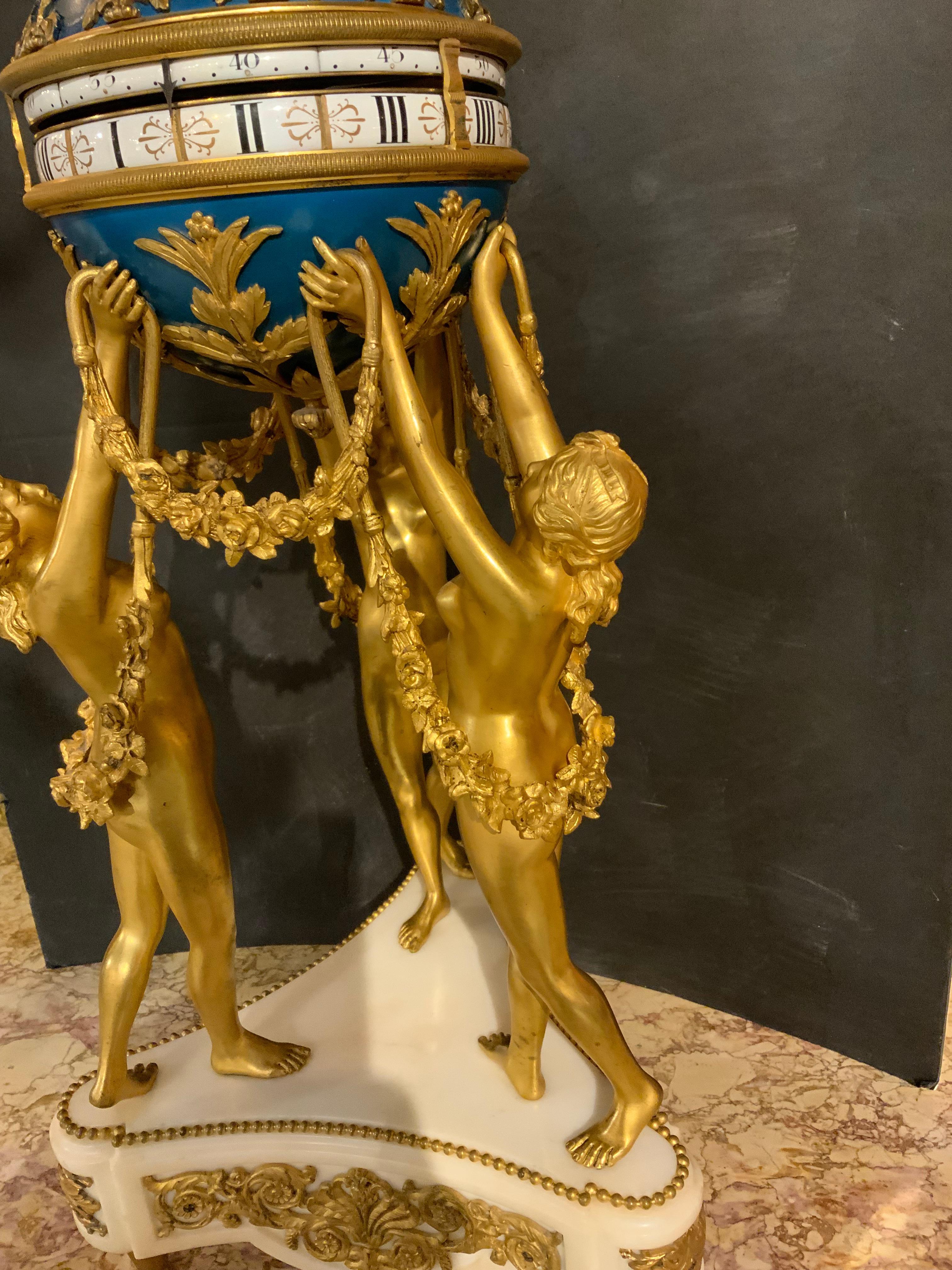 Bronze French bronze dore and marble annular clock depicting the Three Graces For Sale