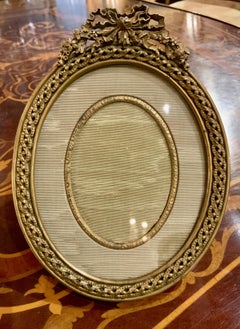French bronze dore oval shaped desk top picture frame