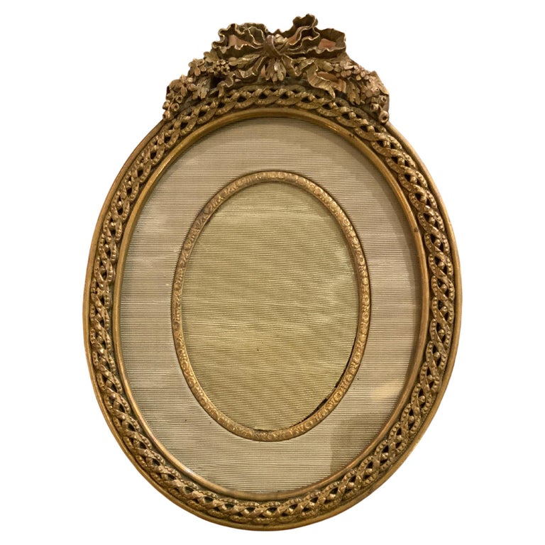 French bronze dore oval shaped desk top picture frame at 1stDibs