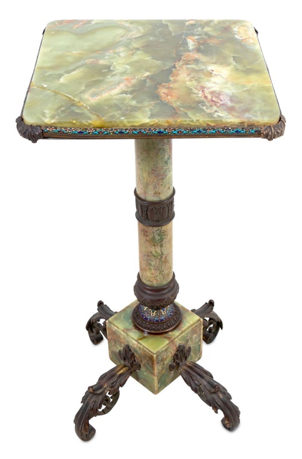 French Bronze and Champleve Enamel Mounted Onyx Pedestal, late 19th century, the large square revolving top above a tapering column, on a cubed plinth issuing four scrolled foliate feet. 34.5