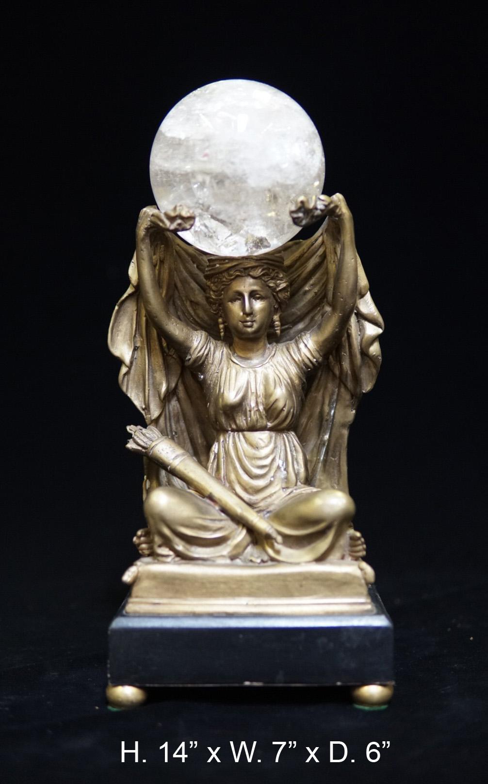 Attractive bronze figure of a seated neoclassical maiden holding a rock crystal sphere on her head, over a conforming square black marble base,
First half of the 20th century.

 