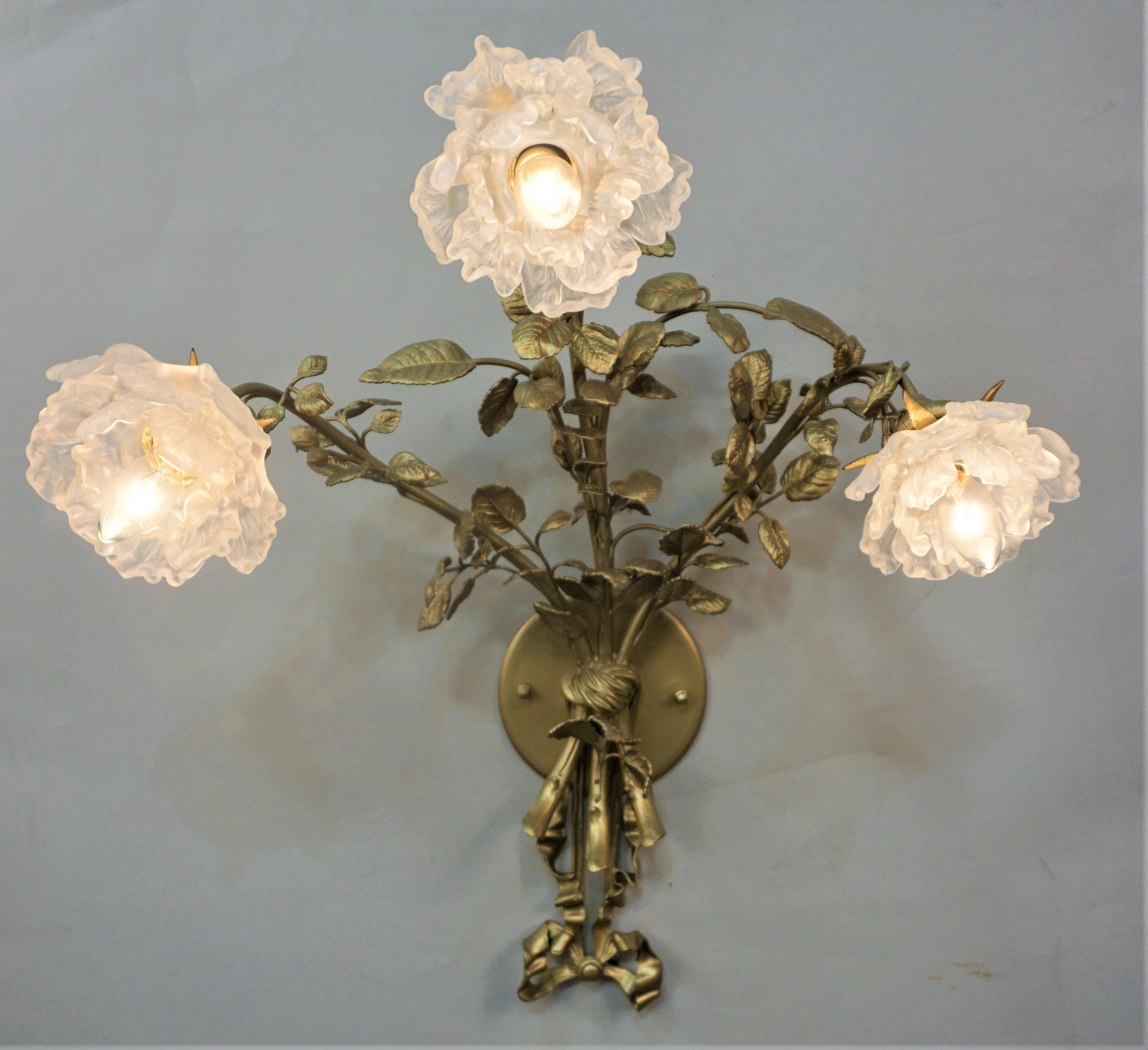 Pair of early 20th century flora design bronze wall sconces with beautiful hand-blown glass shades.