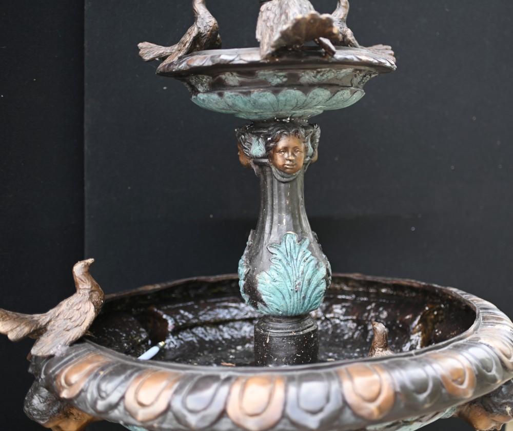 Elegant French bronze garden fountain which is over six feet tall - 205 CM
Great piece for the garden with two tiers to the fountain
Main support flanked by a trio of tall storks
Also features birds to the main bowl and cherub heads from which