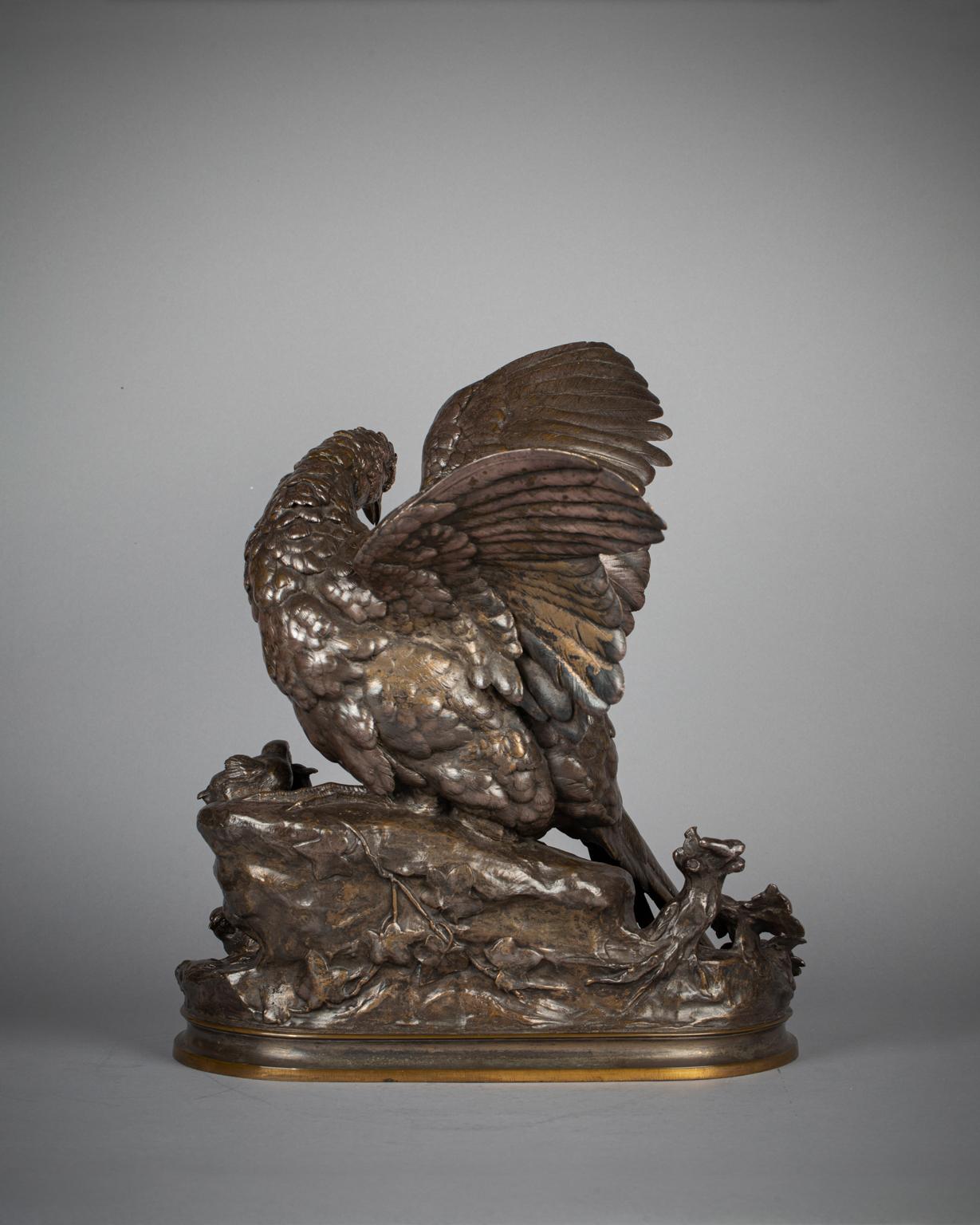 Bronze sculpture of a mother pheasant protecting her chicks from an approaching lizard. Inscribed Arson.