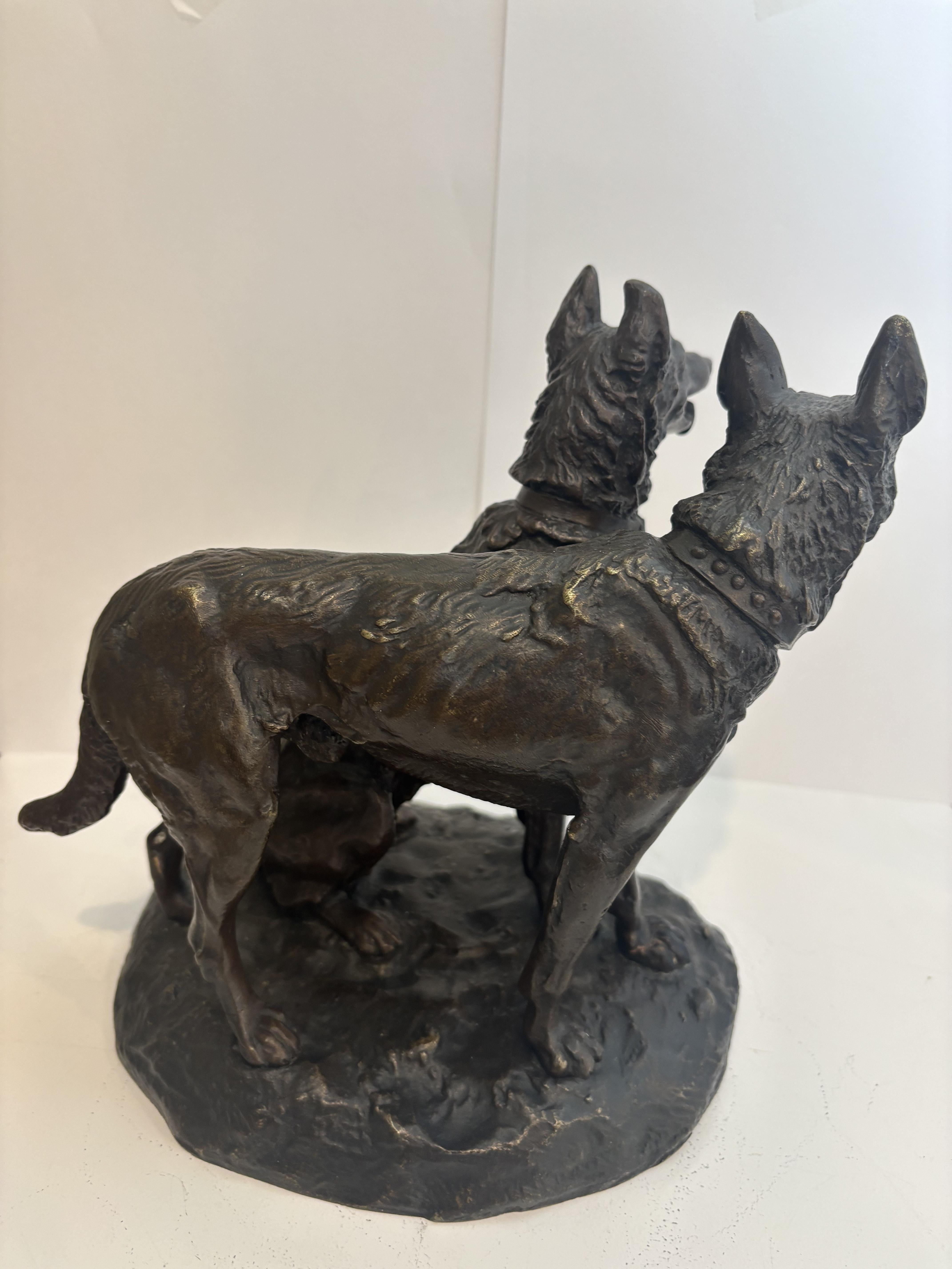 Vittoriano French bronze group of two dogs with one sitting (signed Laplanche) in vendita