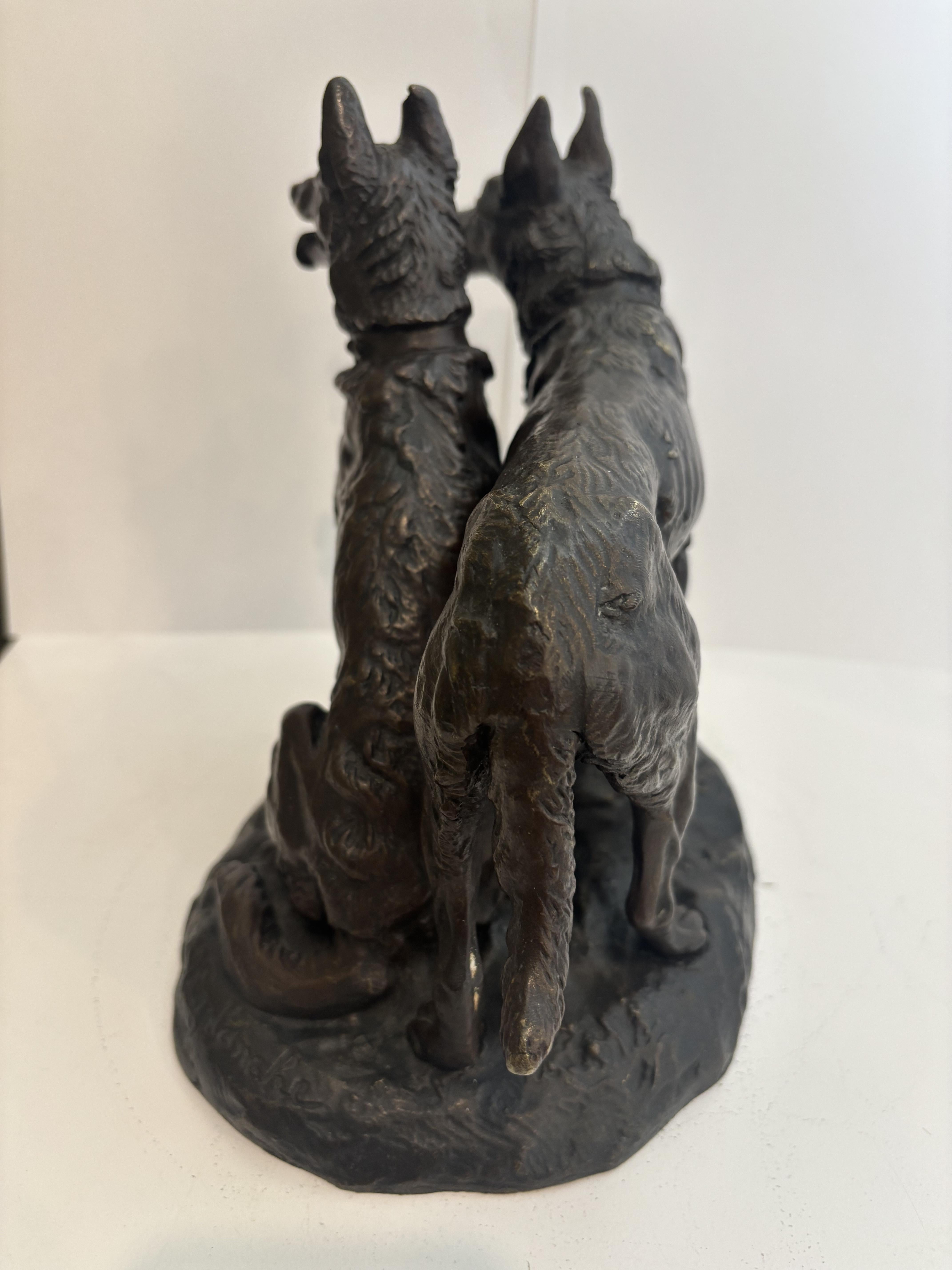 Francese French bronze group of two dogs with one sitting (signed Laplanche) in vendita