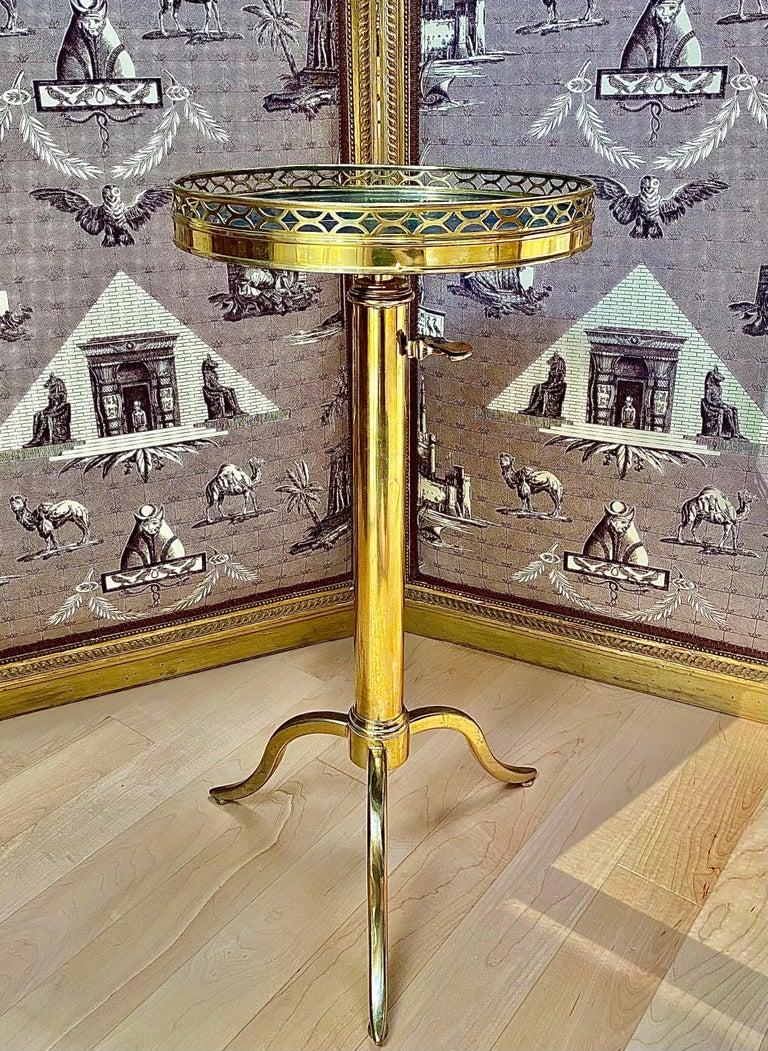 French Bronze Telescopic Guéridon side tables in the Manner of Maison Toulouse. Mid-Century Modern. The very quintescence of chic.

Magnificent bronze end table with bronze galerie surrounding a black marble top and telescoping tripod base. This