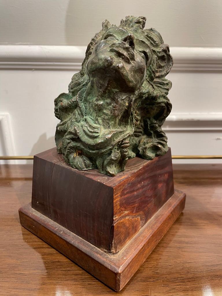 Wonderfully expressive cast bronze 'Head of a Woman' attributed to French sculptor Emile Antoine Bourdelle. The stylized face and flowing hair typical of his later Art Deco inspired works. Lovely verdigis patina with some gilt highlights. Mounted on