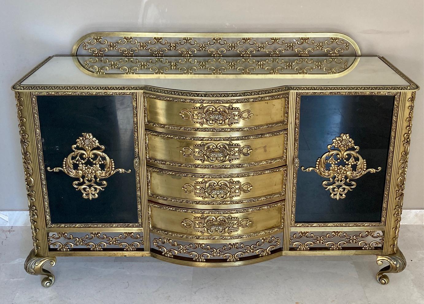 Fabulous 19th century French vanity or dressing table with bronze mirrors with four central drawers and mirror on top of the dresser. It has two black glass doors or cabinet with glass showcases and a top mirror. 
This vintage item has no defects,
