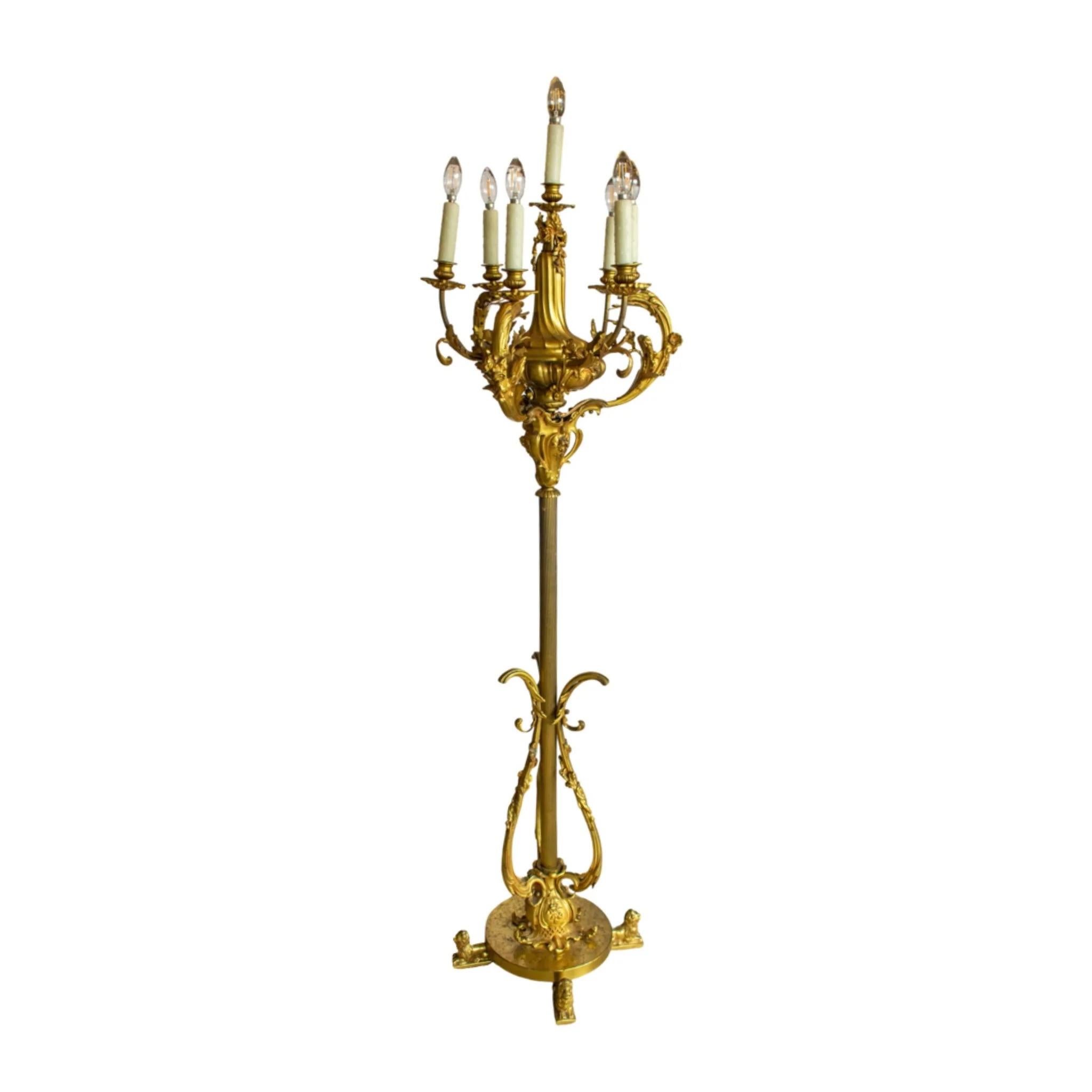 Bronze lamp with baroque style designs. US wired. Originates from France. Circa, 1900.