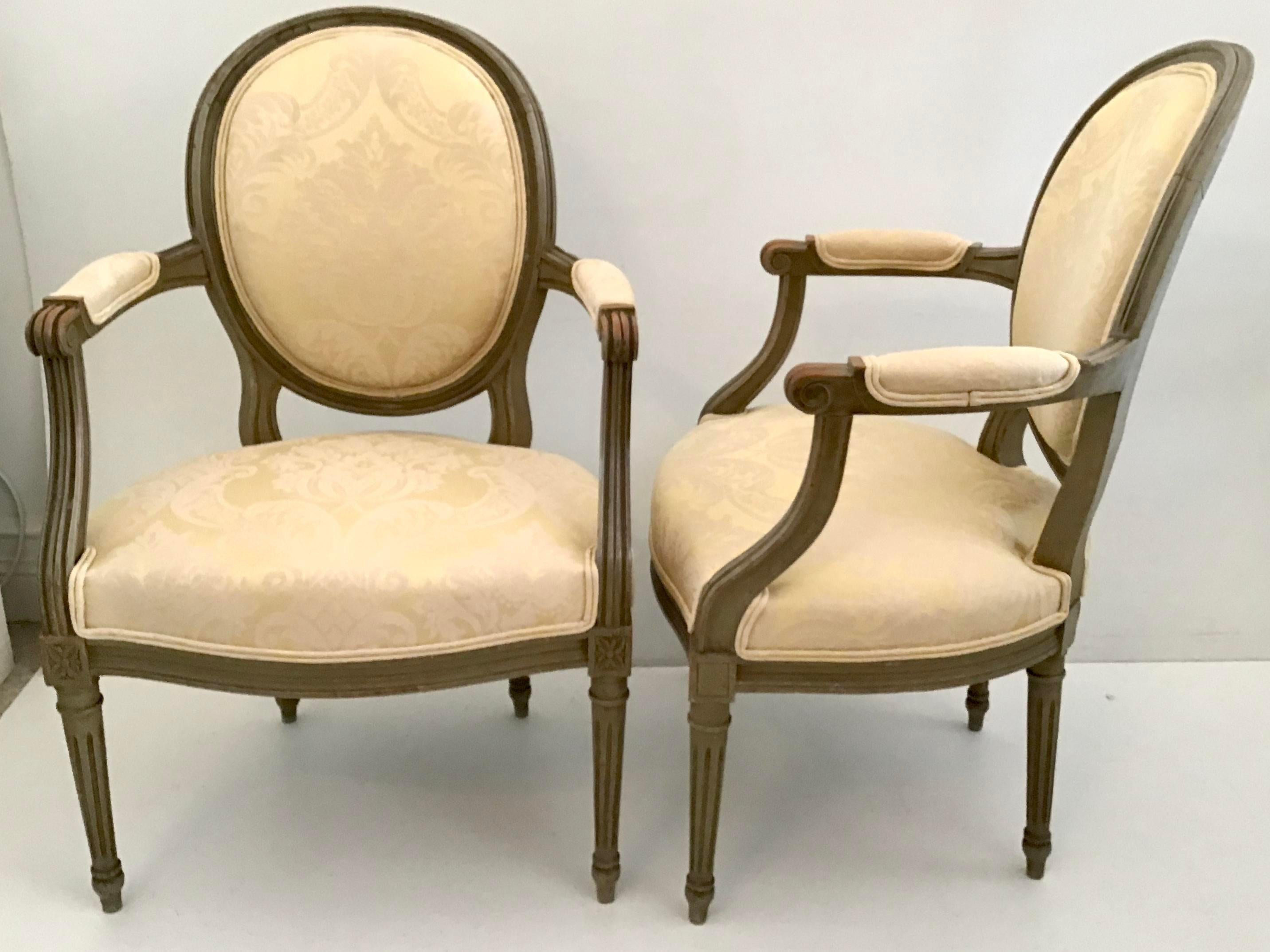 Gorgeous Classic French Louis XVI Fauteuils in a Great painted finish with New Yellow Damask Upholstery. Add Instant Classic French Style to your decor. Beautiful Classical chairs!