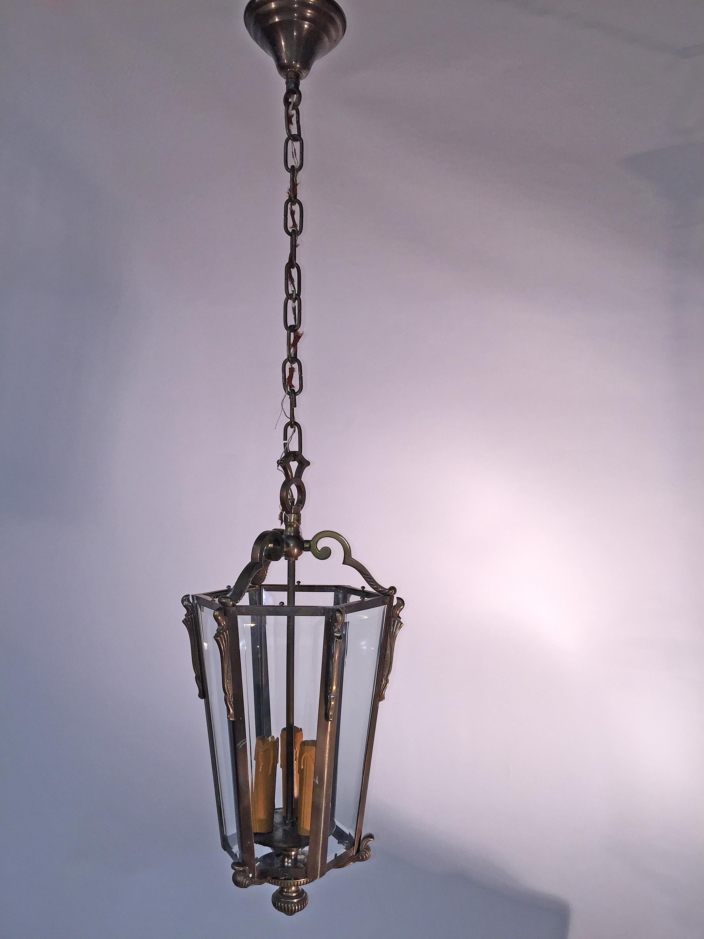 French bronze Louis XVI style hanging lantern, circa 1950
beveled glass.
hight with chain : 110 cm