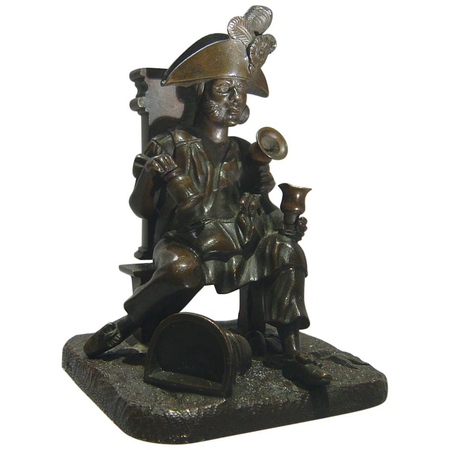 Grattoir d'allumette en bronze français en forme de vendeur d'eau habillé en vieux soldat