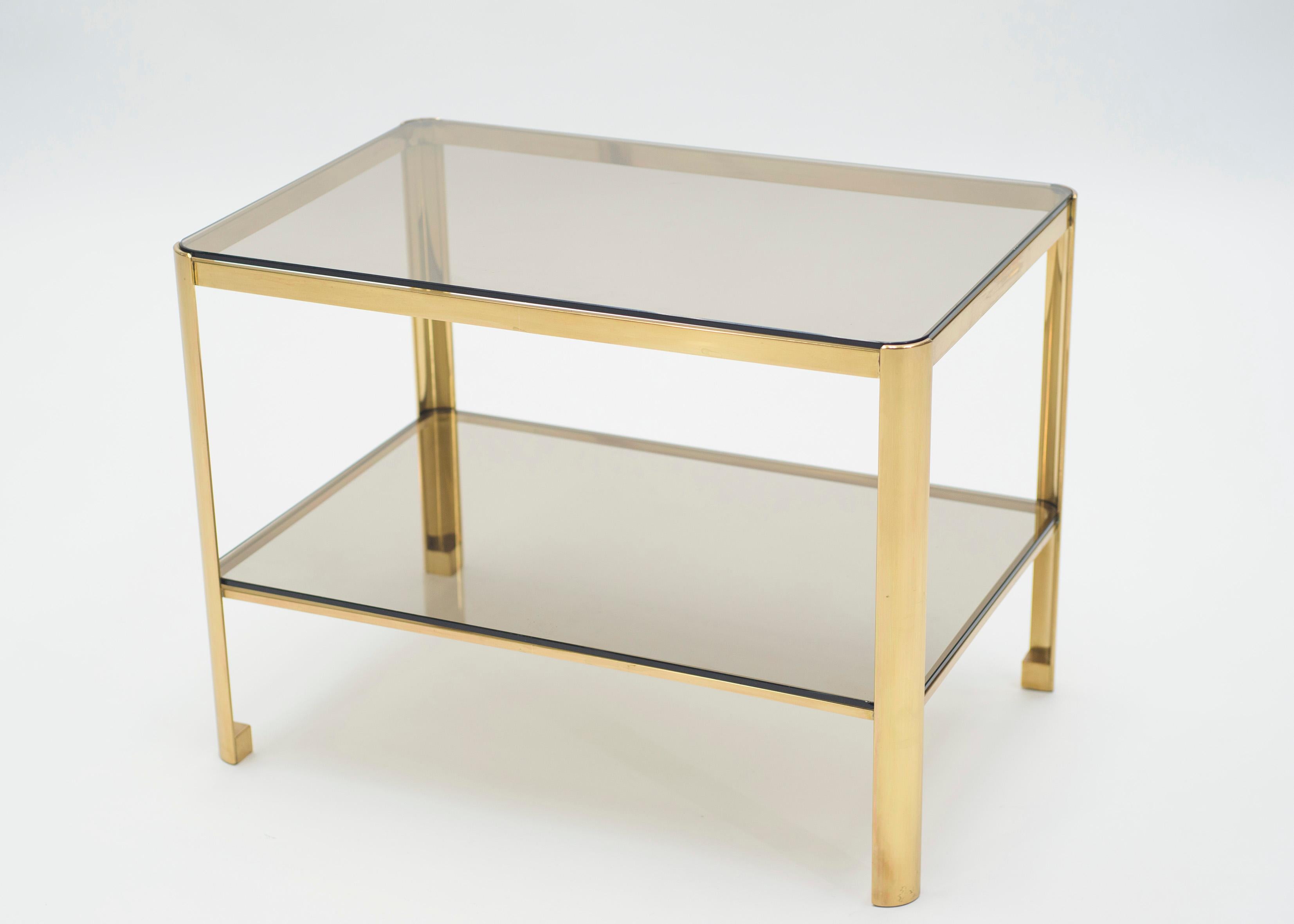 This occasional and side table signed by Jacques Quinet and stamped by Broncz, is a remarkable find. It features a strong, bronze base constructed to last. The 2/3 glass top adds extra storage space as well as aesthetic appeal. This end table will