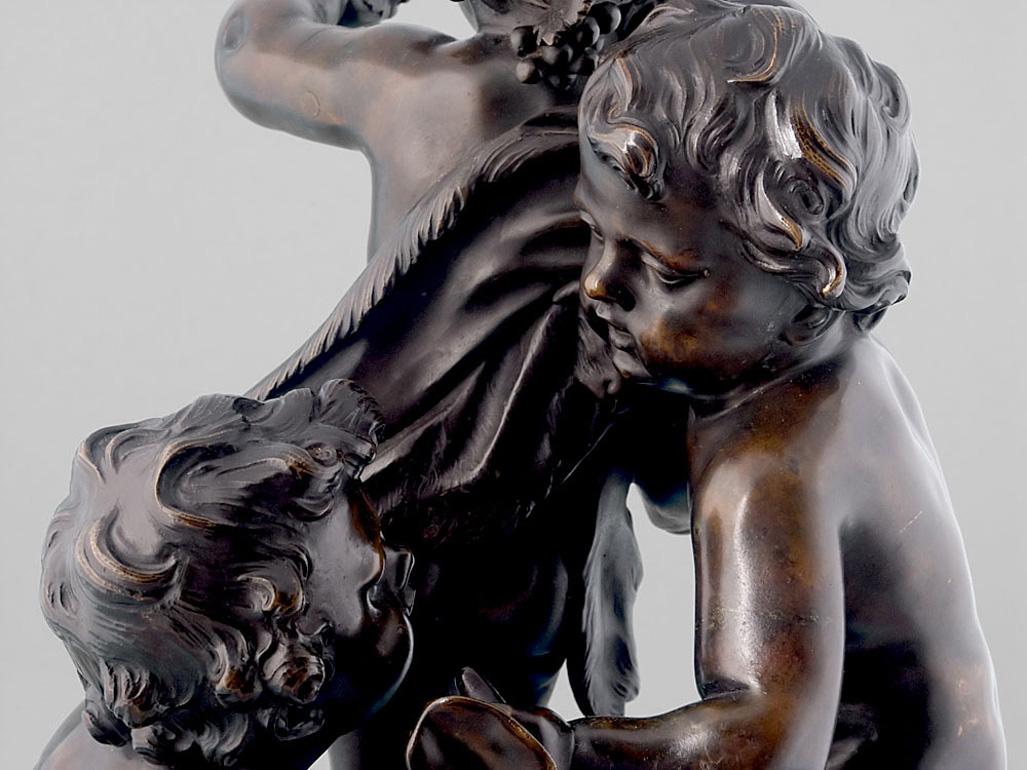 A very fine antique French bronze of three putti playing. Although the bronze group is very much in the manner of Clodion, it is signed 'Musee de Sevres'. The bronze works well from any angle and would be especially suitable as a centerpiece or put