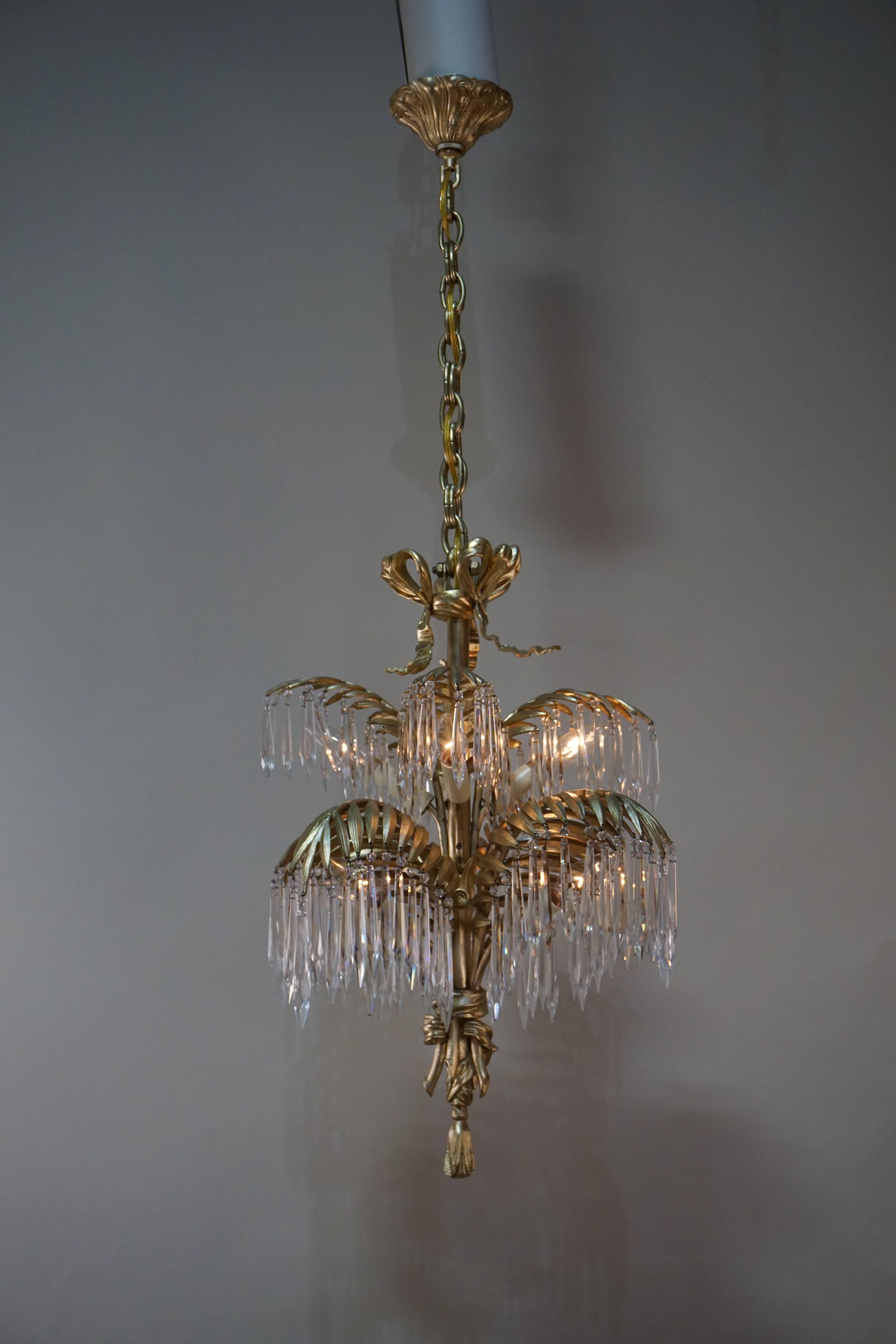 Beautifully made by house of Baguès. Eight-light bronze and crystal chandelier. 
Minimum height fully installed is 30
