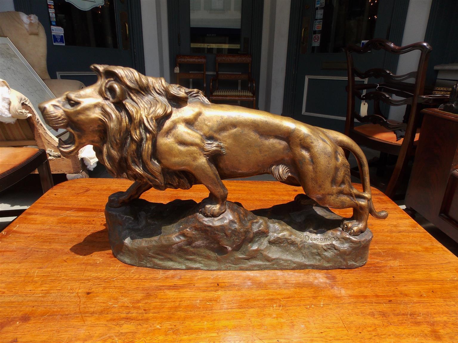 French bronze rampant lion mounted on rocky plinth, Signed by sculptor J.B. Descomps, Early 20th century.