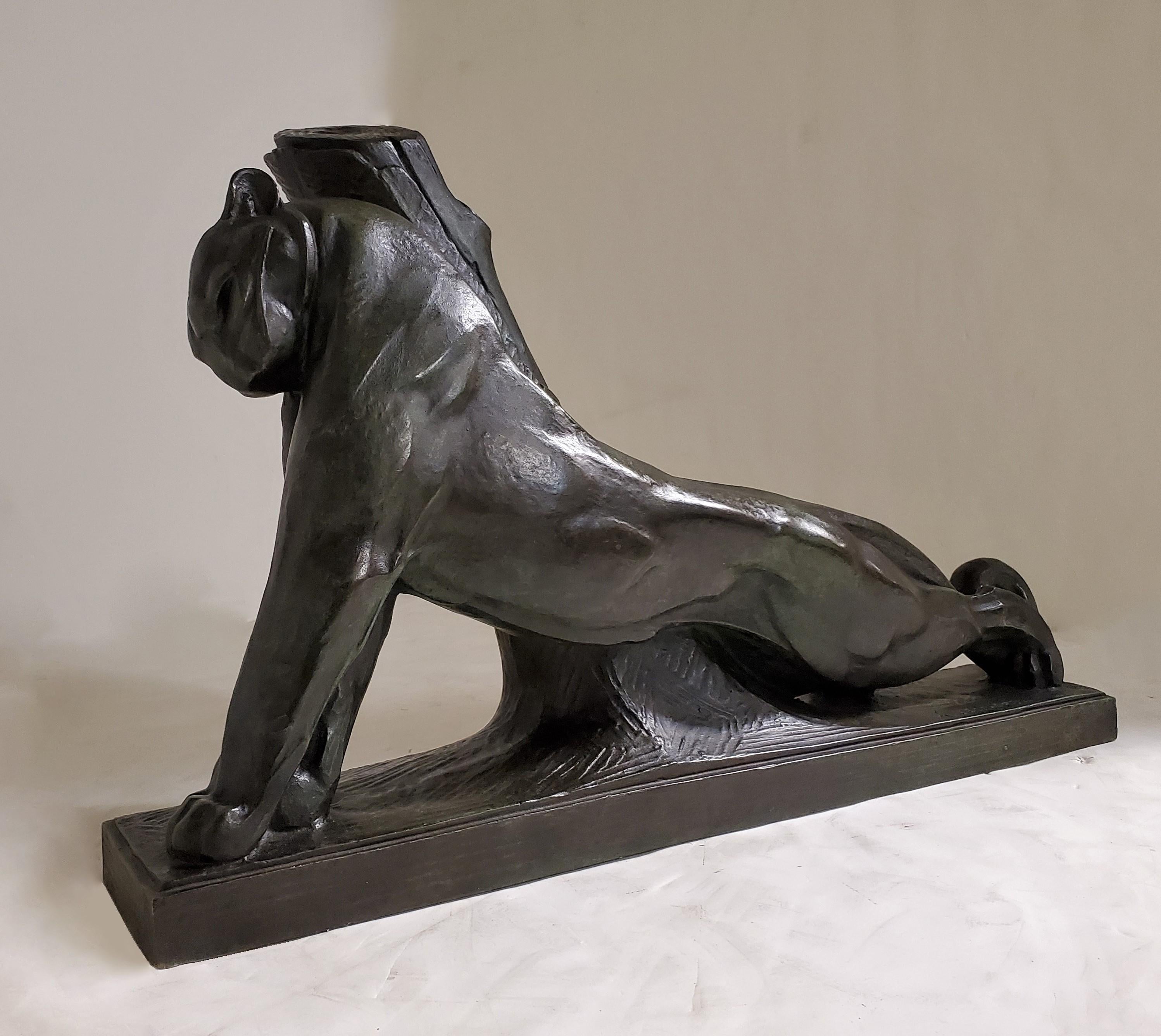 A rare and fabulous French Art Deco large bronze signed sculpture of a bunting panther by Andre Vincent Becquerel, French, 1893-1981
 This lovely cast, in a warm dark brown patina with green undertones is sculpted with highly stylized anatomical