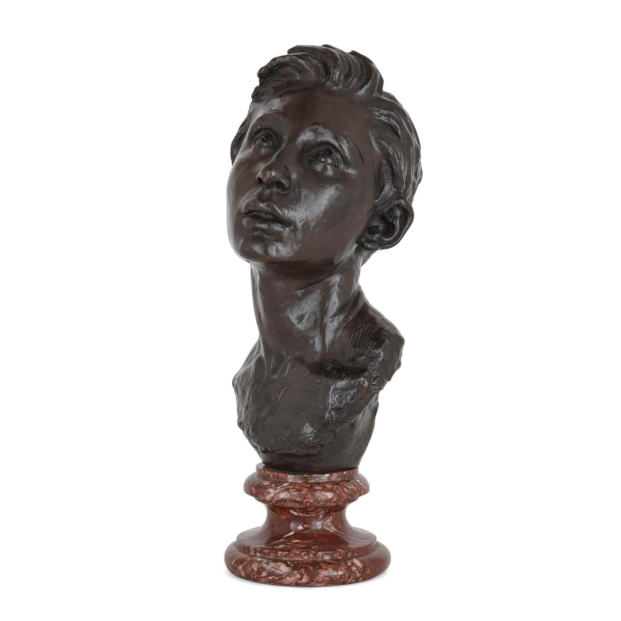 French bronze sculpture bust of a man by Aimé-Jules Dalou
French, 1888
Measures: height 49cm, width 20cm, depth 21cm

This fine patinated bronze bust by the French sculpture Dalou portrays a young, idealistically beautiful man. The sitter gazes