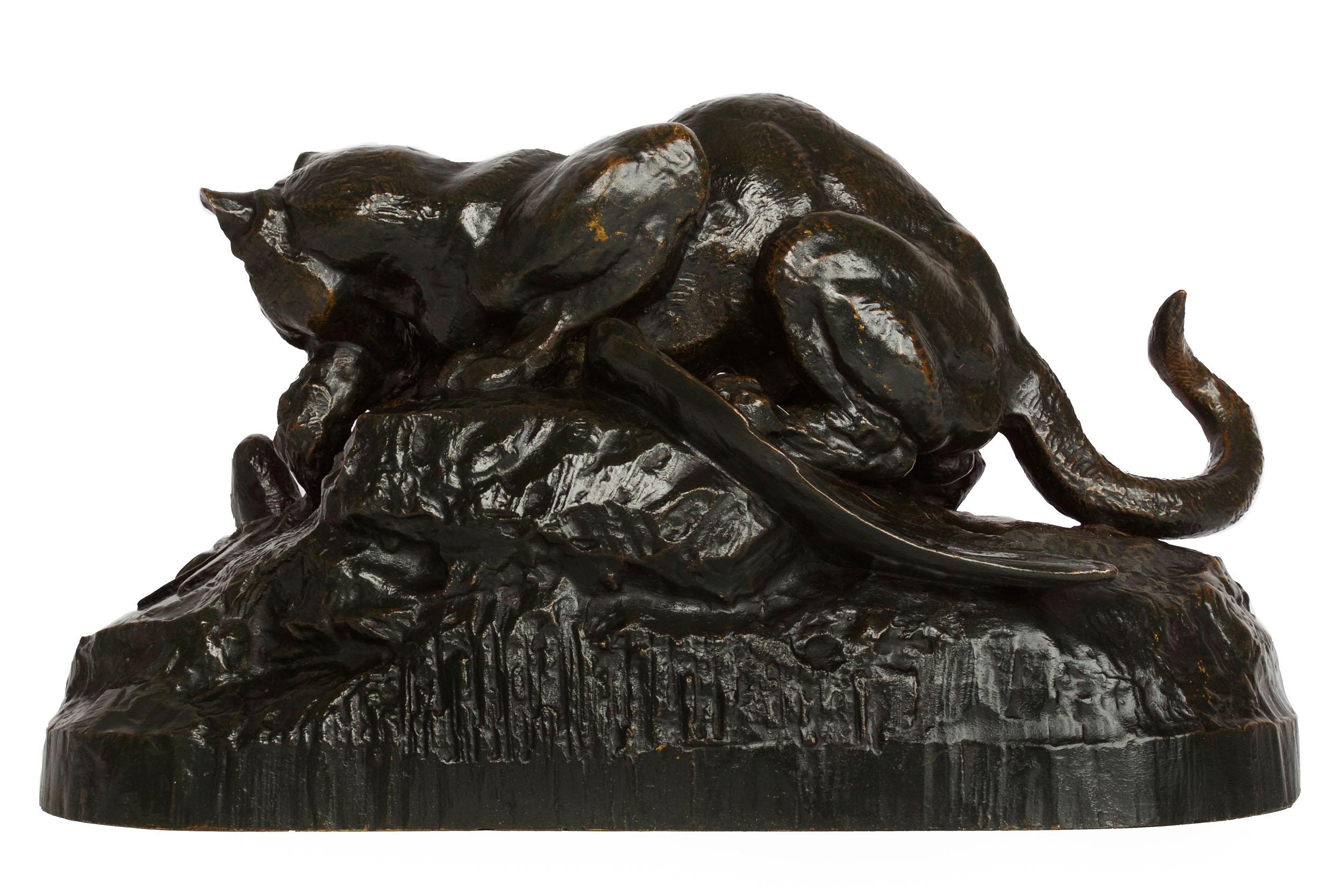An early Barbedienne casting from the molds acquired at the sale of Barye's estate in 1876 for 500 francs (no. 590), the model depicts a wild Ocelot dragging a Heron across the soil. The angular composition of the scene is notable with a distinct