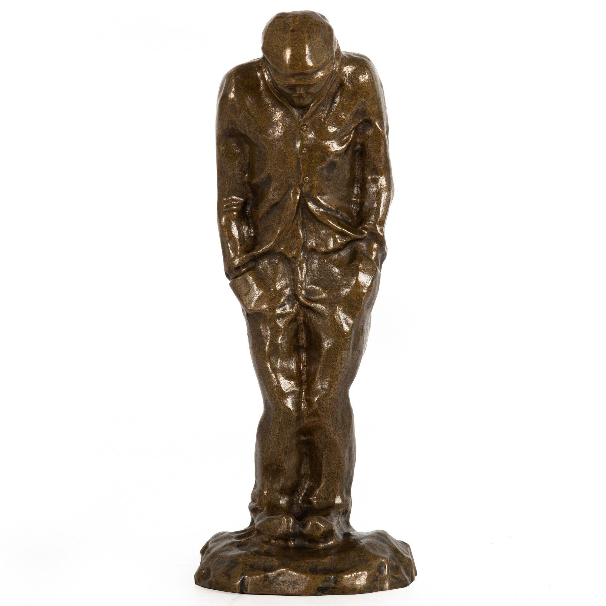MANNER OF CONSTANTIN MEUNIER [French, 1831-1905]

A Shivering Worker

Sand-cast patinated bronze  signed to the base 