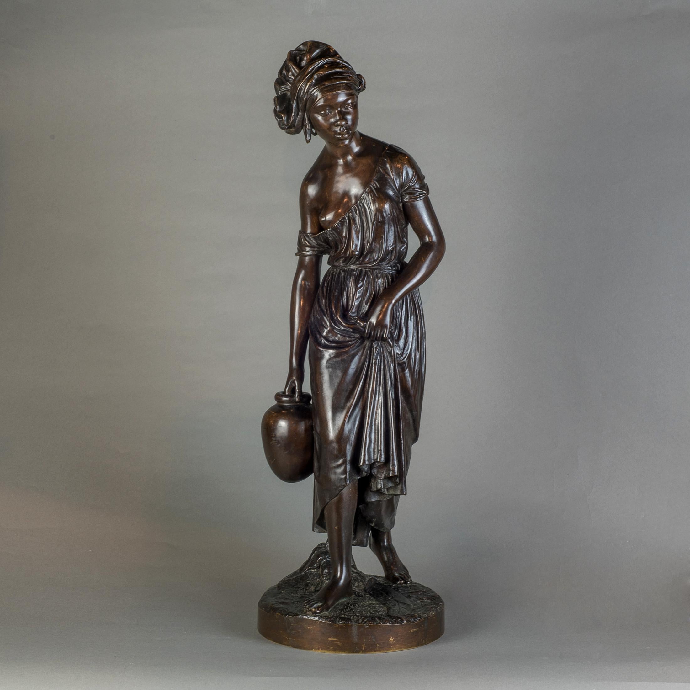 The French bronze sculpture depicts a Nubian woman in a head scarf, carrying water. The sculpture shows her in movement, holding her dress, about to place her right foot in front. Signed by artist on the base 

Artist: Charles Cumberworth
