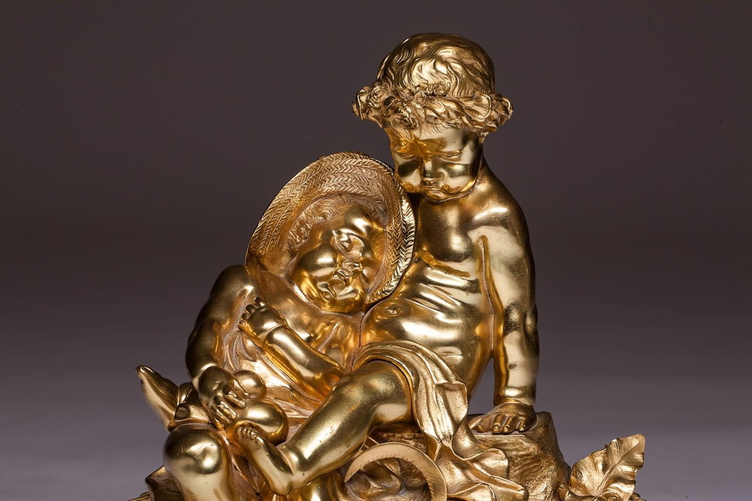 French bronze sculpture with two cherub putti on the marble base 19th century. French figure from the late 19th century. One cherub is sitting and holding other baby with a hat. They are on the small wheat hill. This bronze statue is standing on the