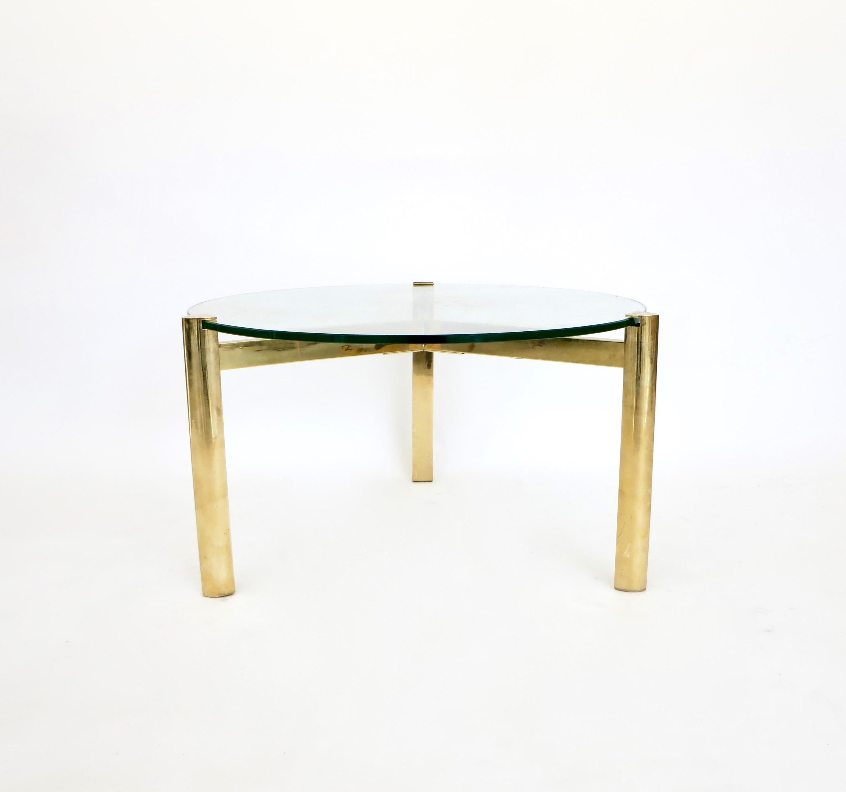 A French bronze 3 legged coffee table with thick St Gobain glass or side table circa 1970 attributed to Jacques Quinet.
The half inch glass inserts into the bronze frame and appears to float.
The bronze has an excellent patina and no pitting. It