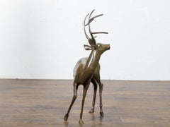French Bronze Stag Sculpture with Large Antlers and Brownish Green Color