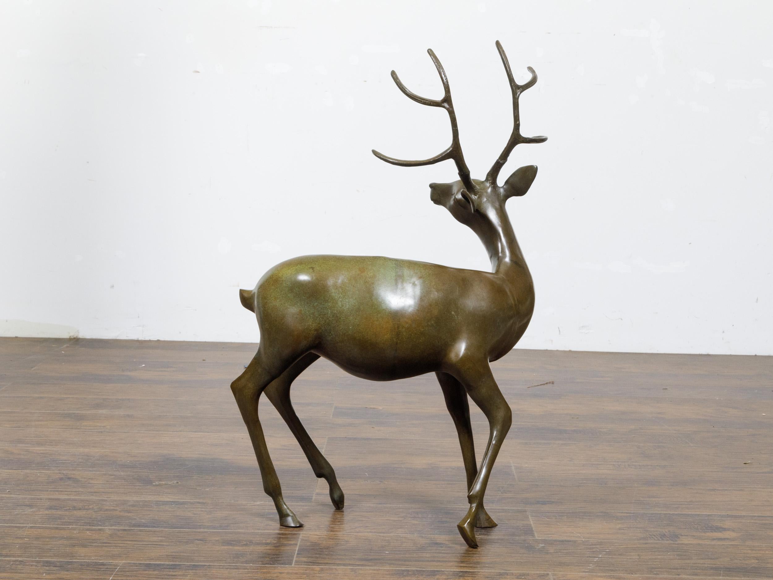 20th Century French Bronze Stag Sculpture with Large Antlers and Brownish Green Color For Sale