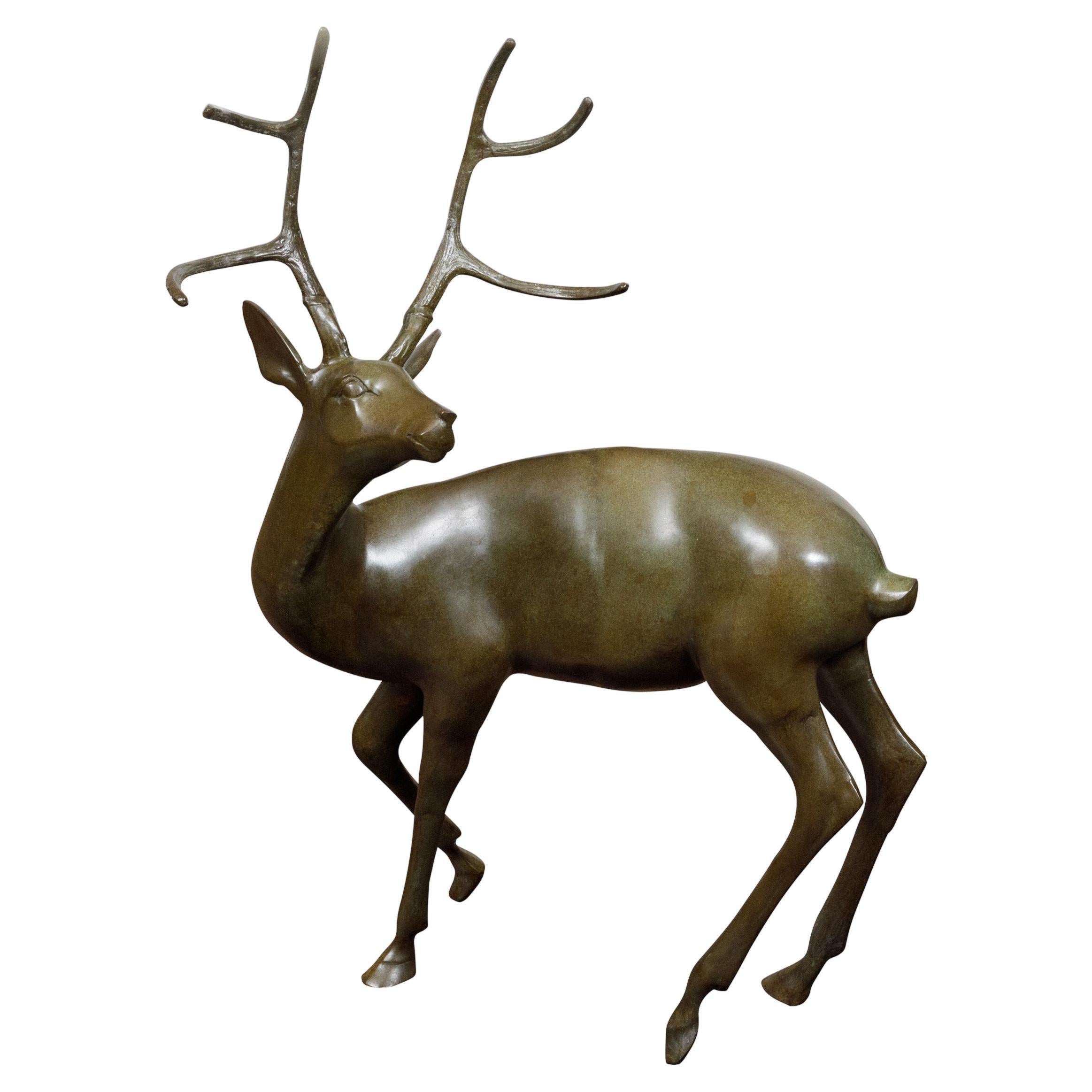 French Bronze Stag Sculpture with Large Antlers and Brownish Green Color For Sale