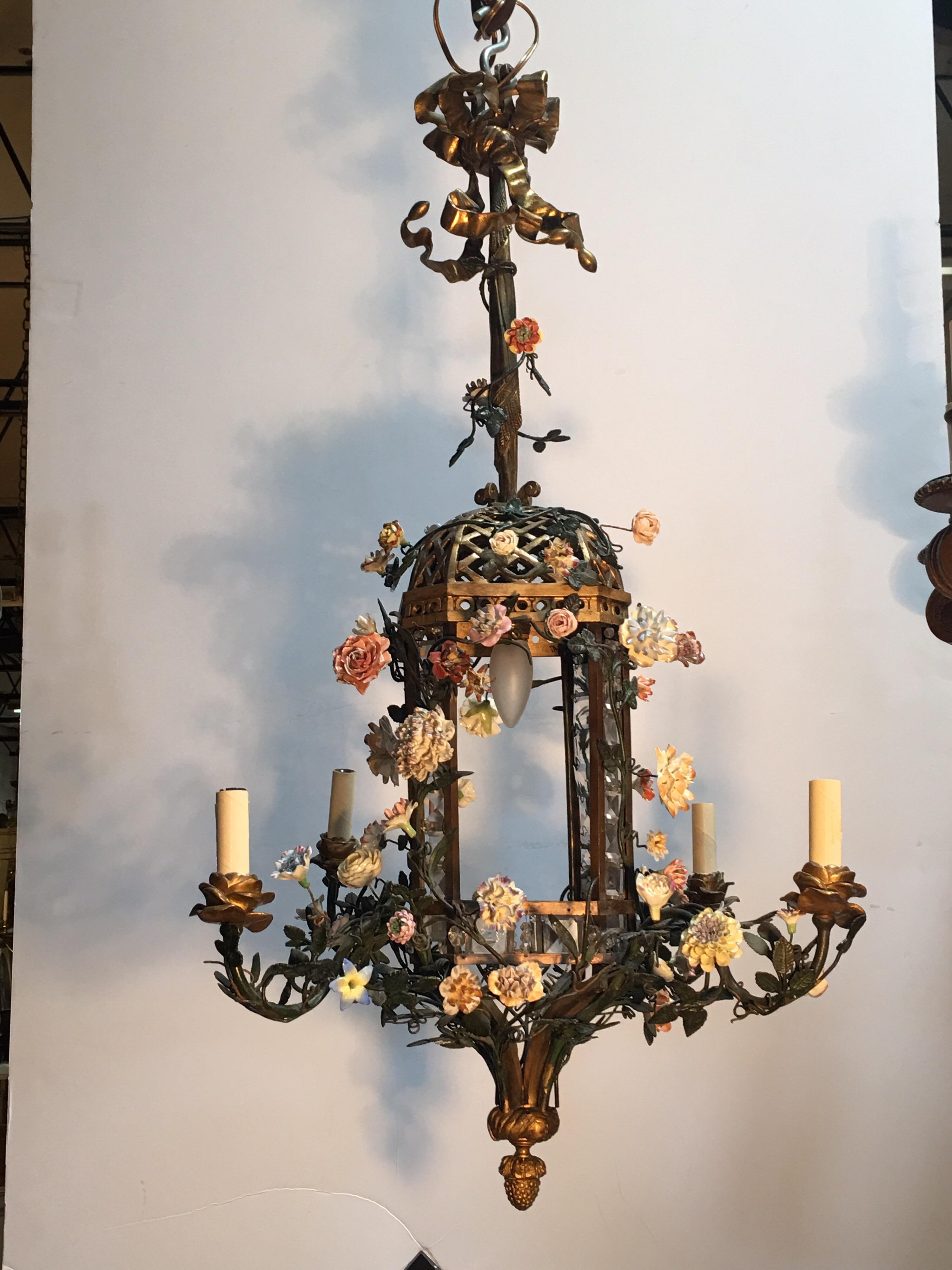 A French bronze tole and porcelain flower chandelier in the style of Napoleon III.