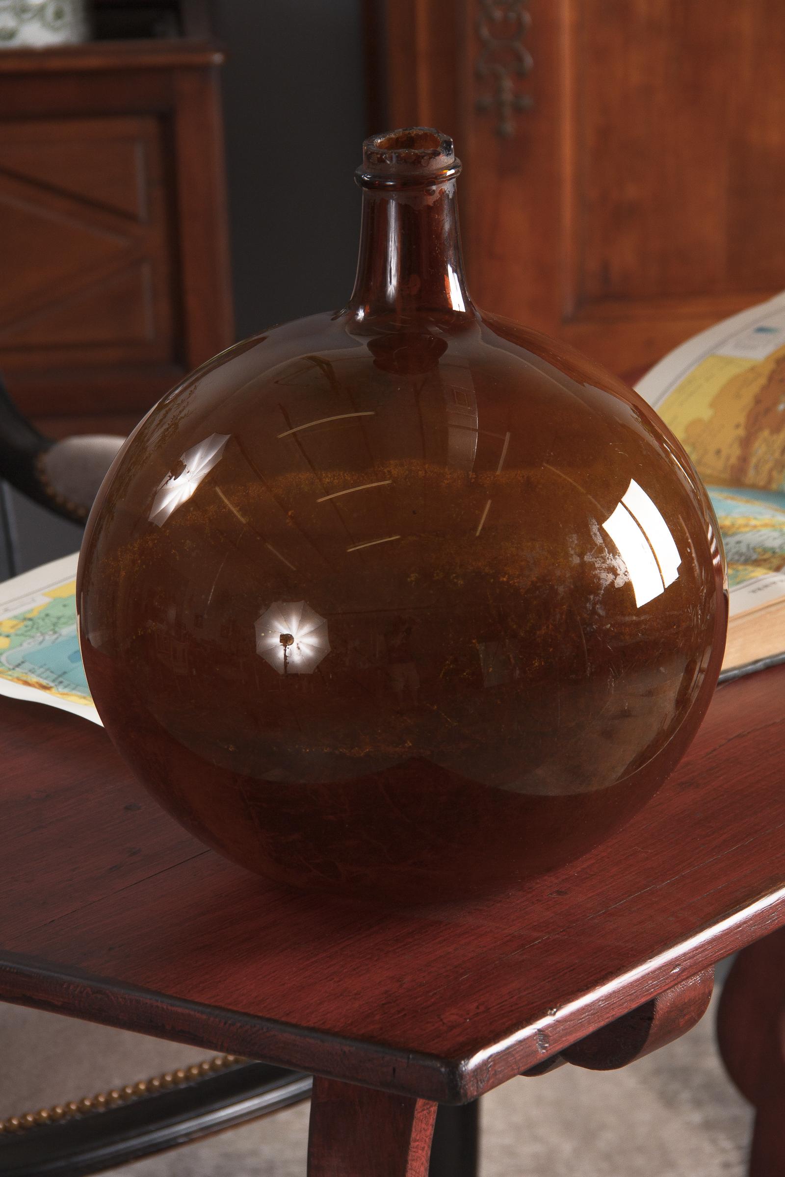 A 19th century glass Bonbonne from Provence in brown tones. The shape is quite rare.