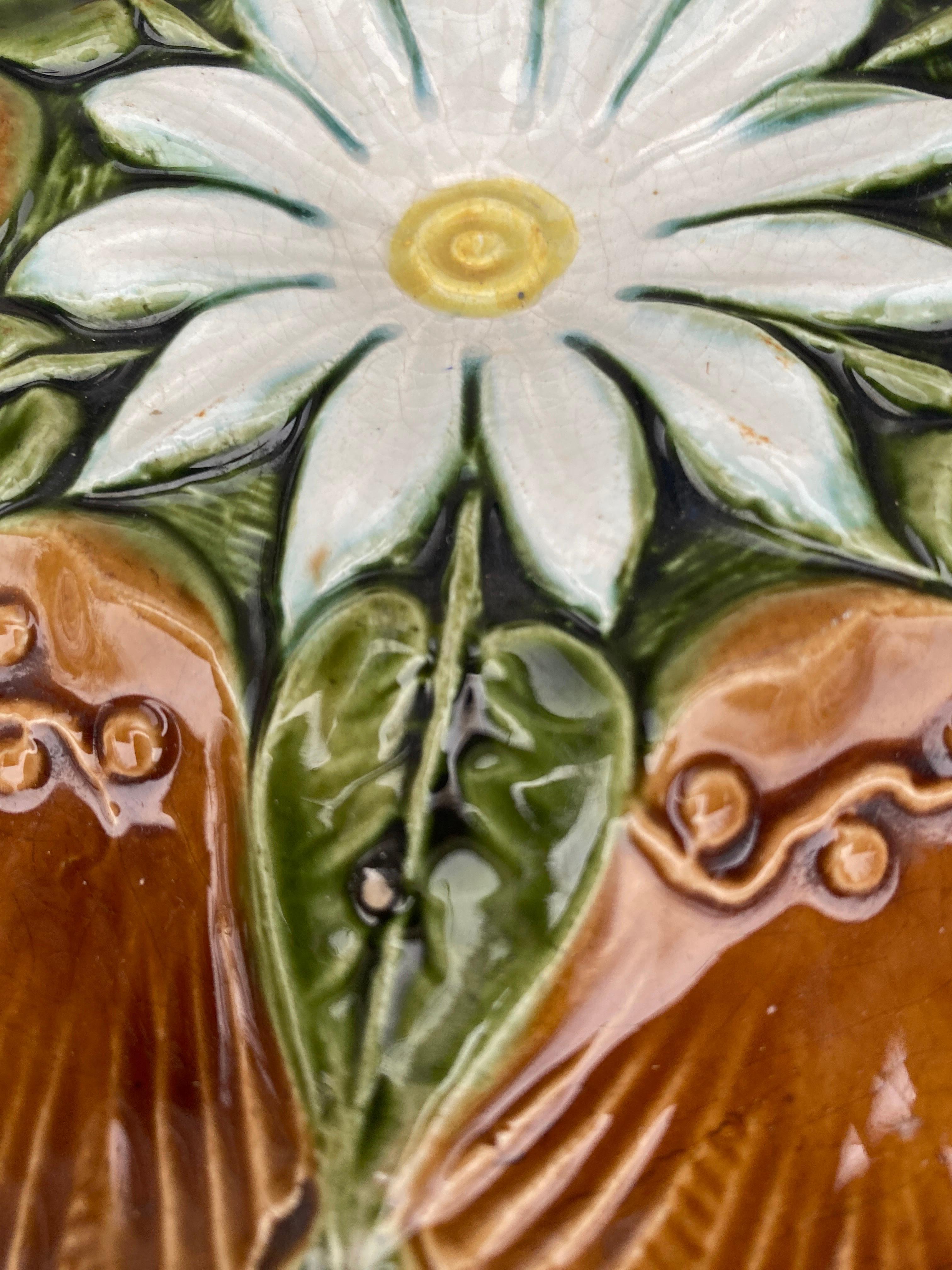 Very rare French Majolica oyster plate, circa 1890.
White flower on the center and leaves.