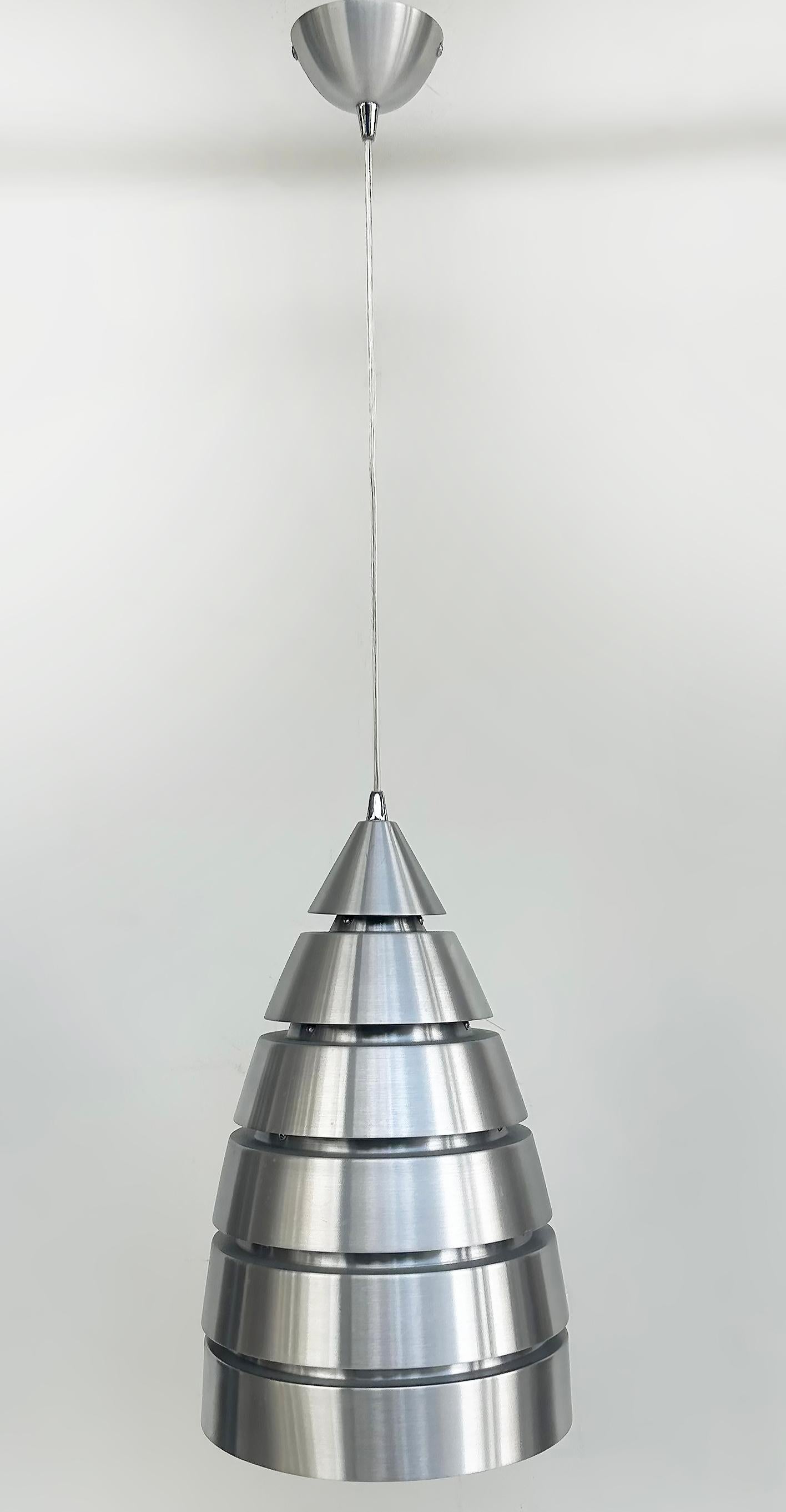 French Brushed Aluminum Pendant Light Fixtures with Canopy, Standard Sockets 

Offered for sale is a find from the Marche de Puces in Paris. This is a pair of brushed aluminum vintage pendant light fixtures. They include the original canopies and