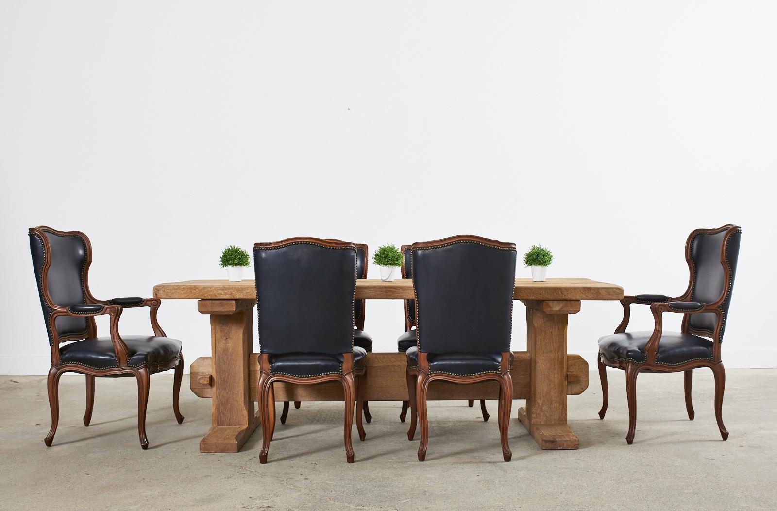 Imposing French brutalist moderne farmhouse dining table featuring a rustic bleached oak finish. Beautifully crafted with solid oak timbers having minimal finishing and large scale proportions but still keeping the narrow European farmhouse design.