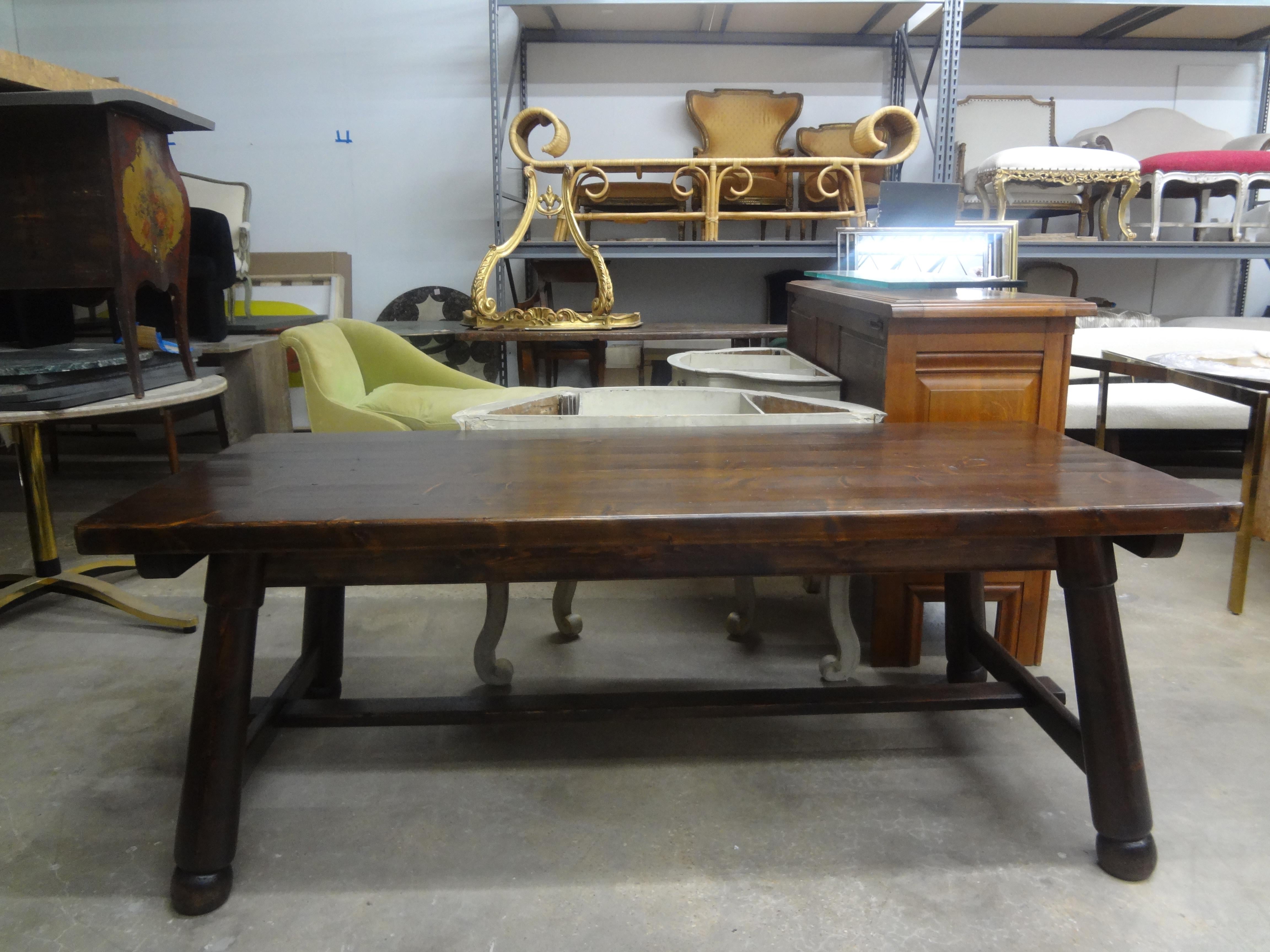 French Brutalist Dining Table By Georges Robert.
Our handsome French Brutalist table, dining table, library table or trestle table is constructed of solid pine and features a stretcher, conical legs terminating in ball feet and a rich patina.