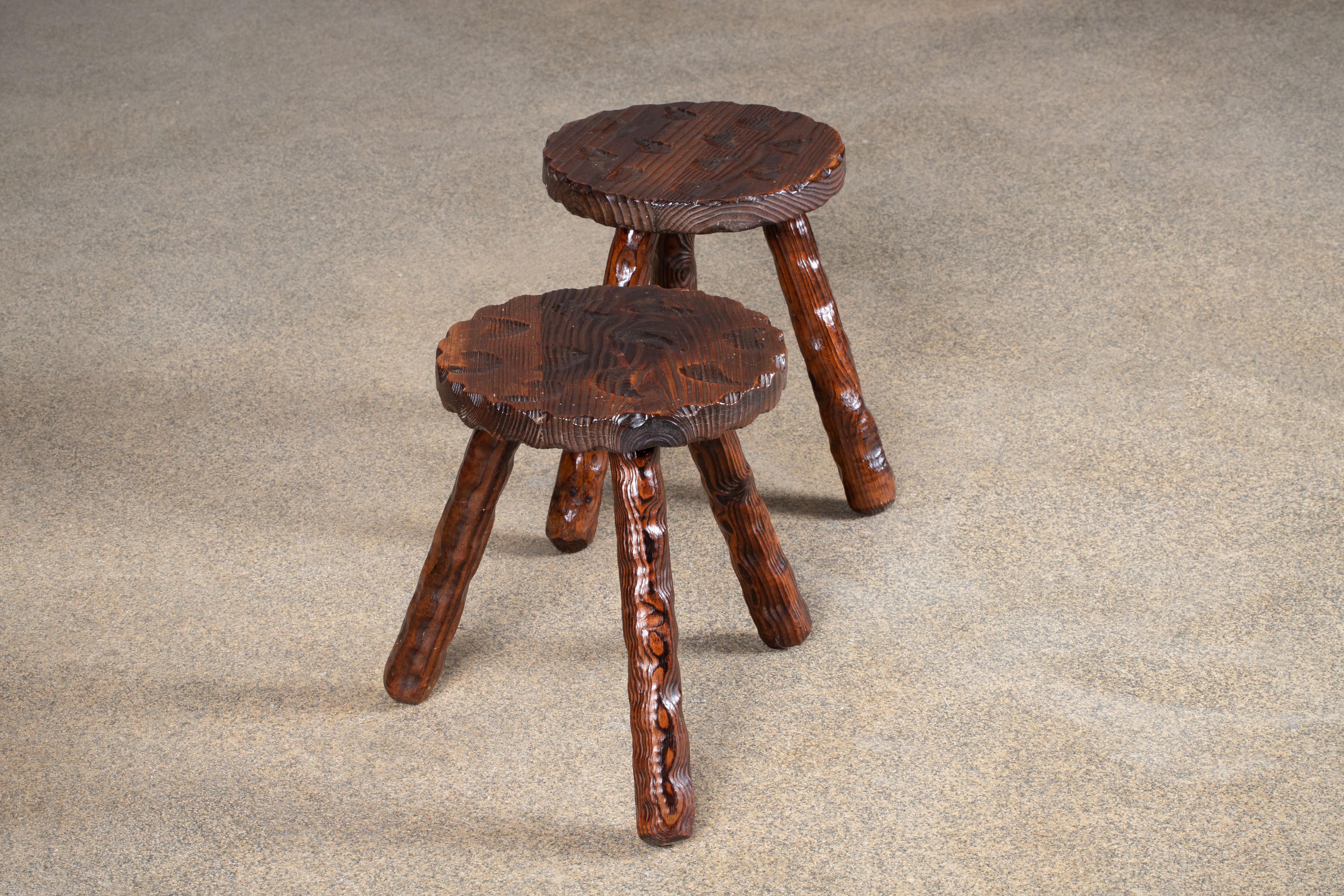 Fantastic wood stool from France reminiscent the work of Jean Touret, Atelier Marolles. Made in the 1960s with three legs. No hardware. Good vintage condition.
 