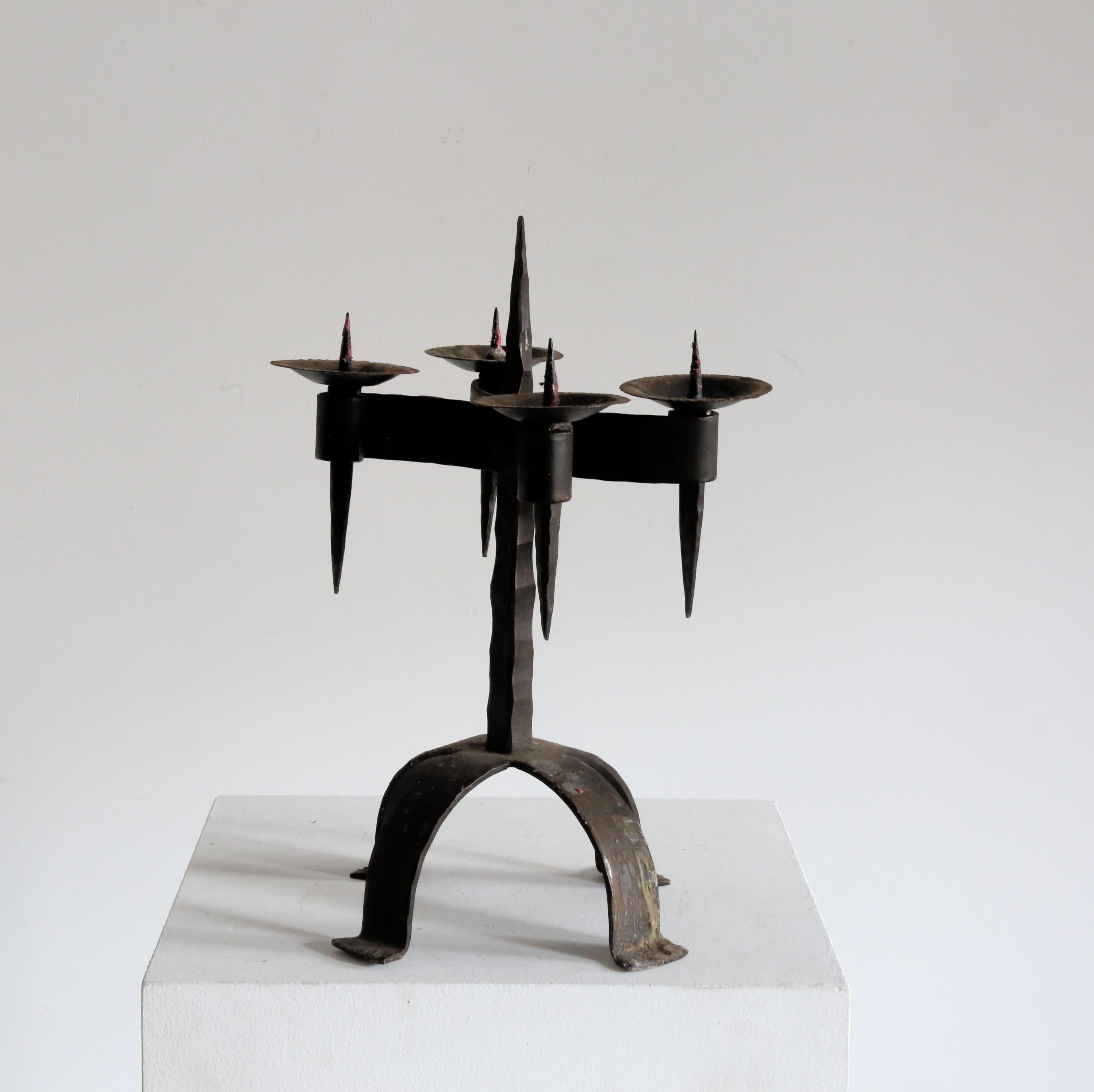 Hand-forged Blacksmith made brutalist candelabra. 

Each individual holder is detachable from the stand, for guiding oneself around the castle grounds at night!

France 1960s 