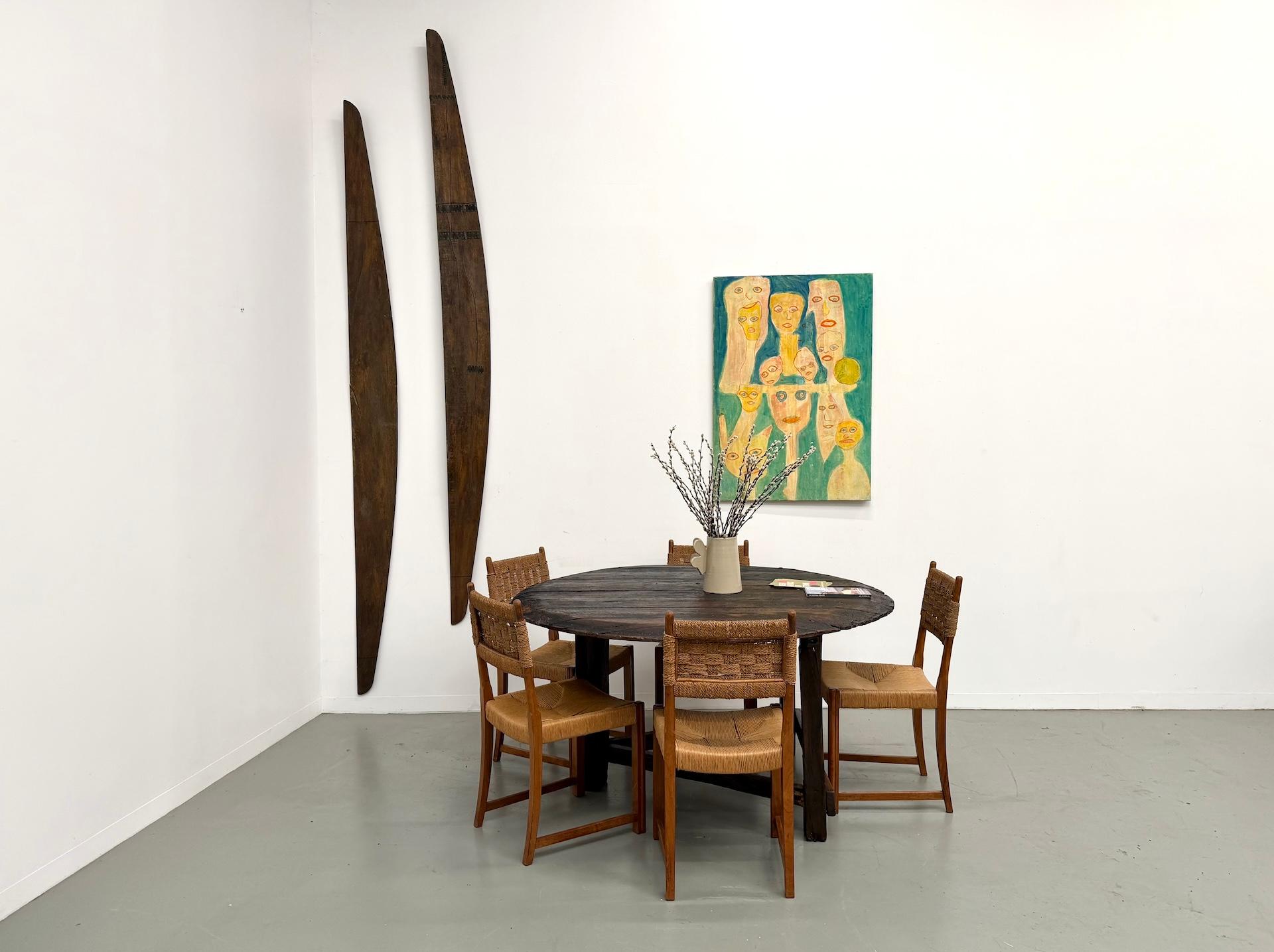 Maison Lecan presents this popular-art round oak table, c.1880.

A unique, powerful piece embodying 19th-century rural craftsmanship. The circular top, made of thick oak planks, shows a spectacular irregular edge with a dark, time-worn patina. Tool