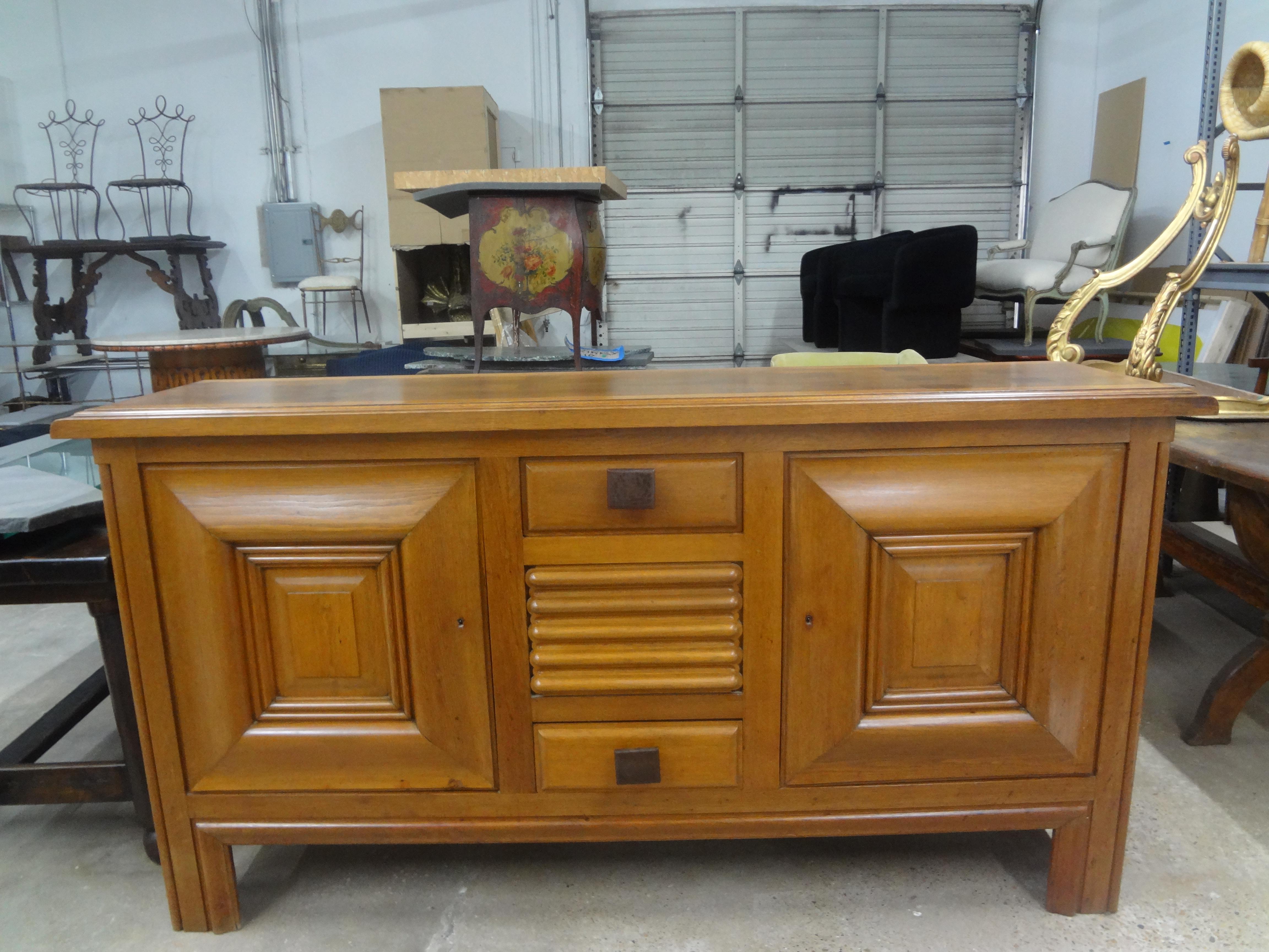 French Brutalist Sideboard Signed Charles Dudouyt.
This French Modern credenza, sideboard or enfilade has two cabinet doors, two drawers with two original keys and beautiful bronze hardware.  The piece is signed by the maker, Charles Dudouyt as