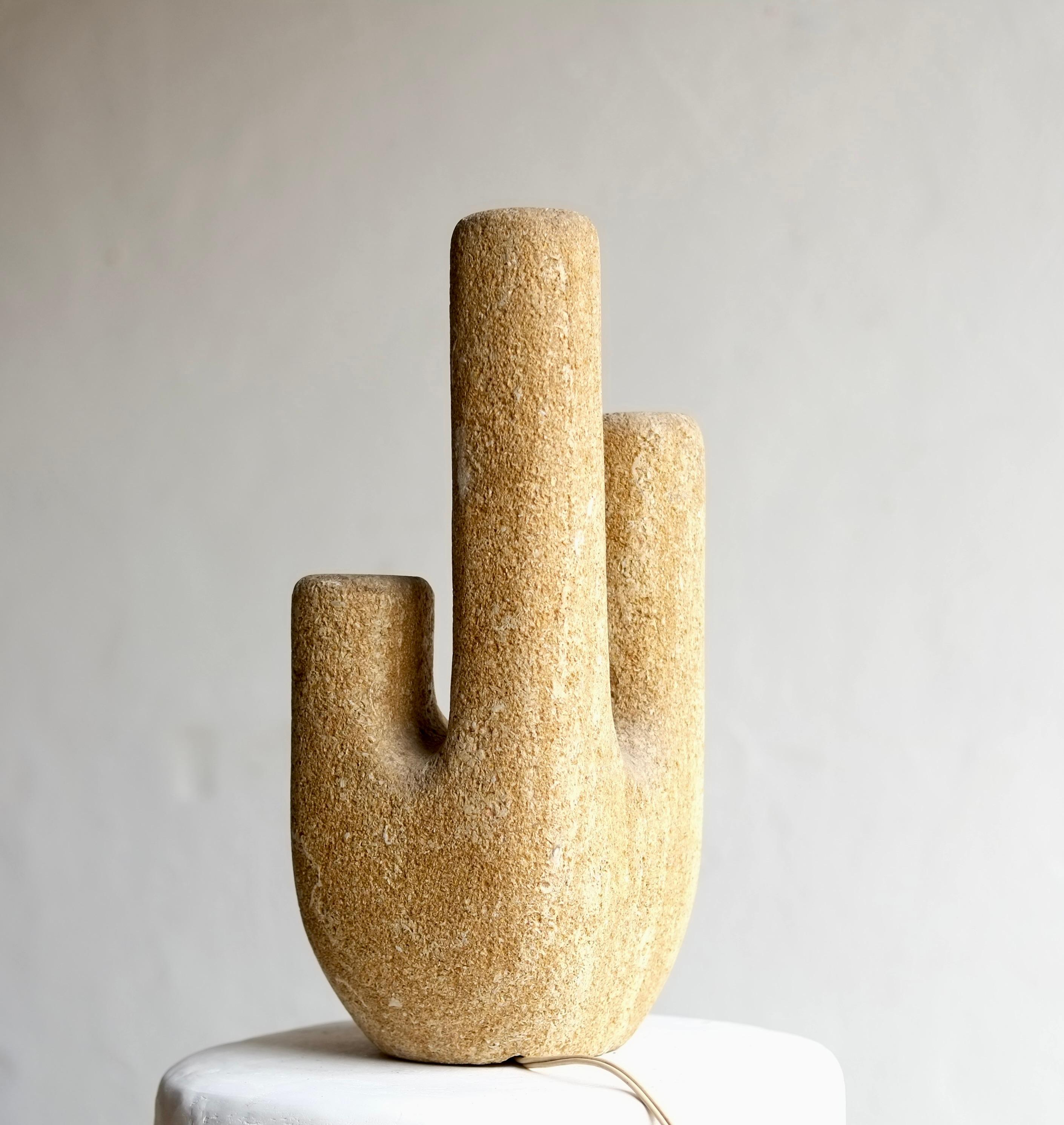 A French brutalist sculptural stone lamp in the manner of Albert Tormos. 