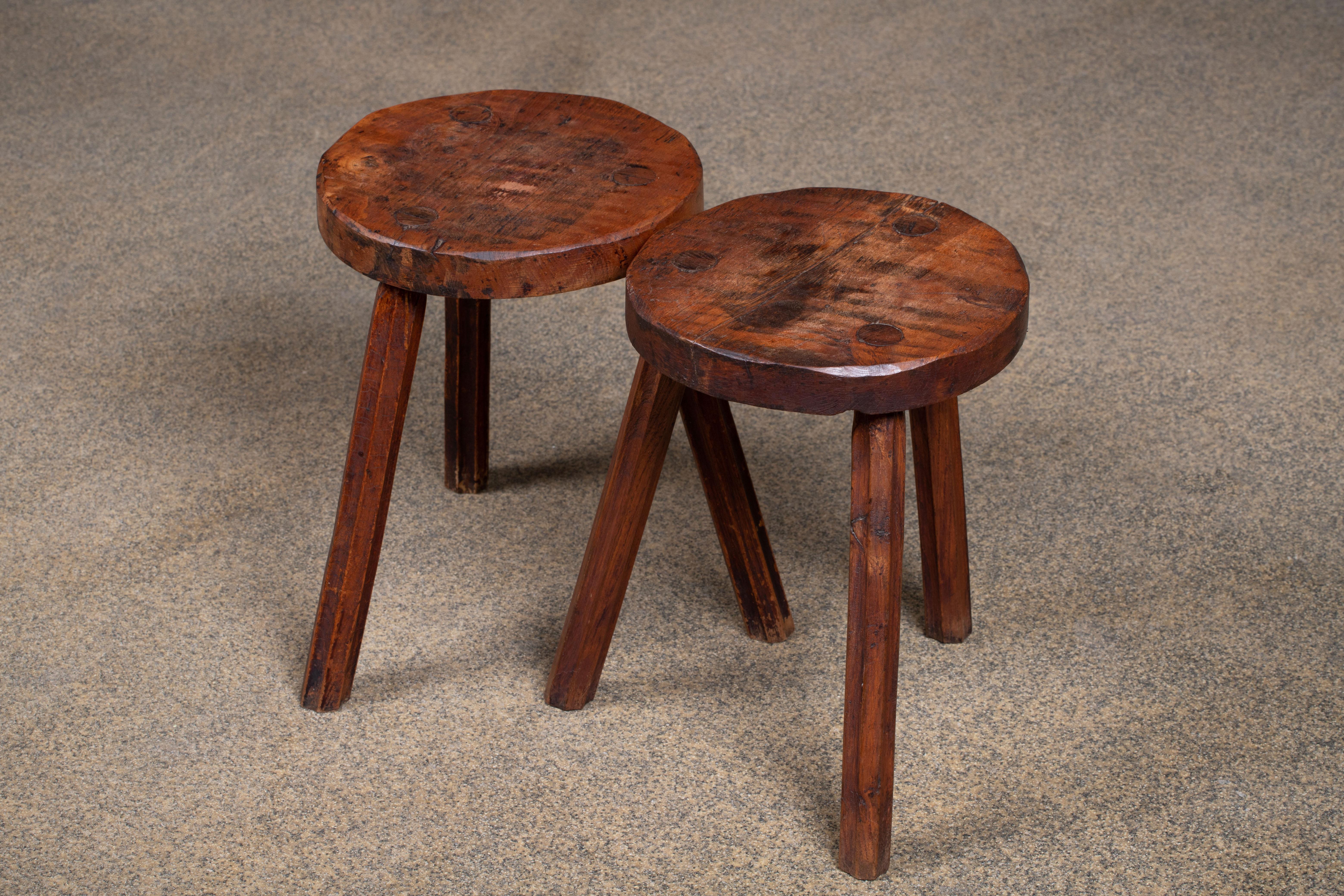 Fantastic wood stool from France reminiscent the work of Jean Touret, Atelier Marolles. Made in the 1960s with three legs. No hardware. Good vintage condition.
 