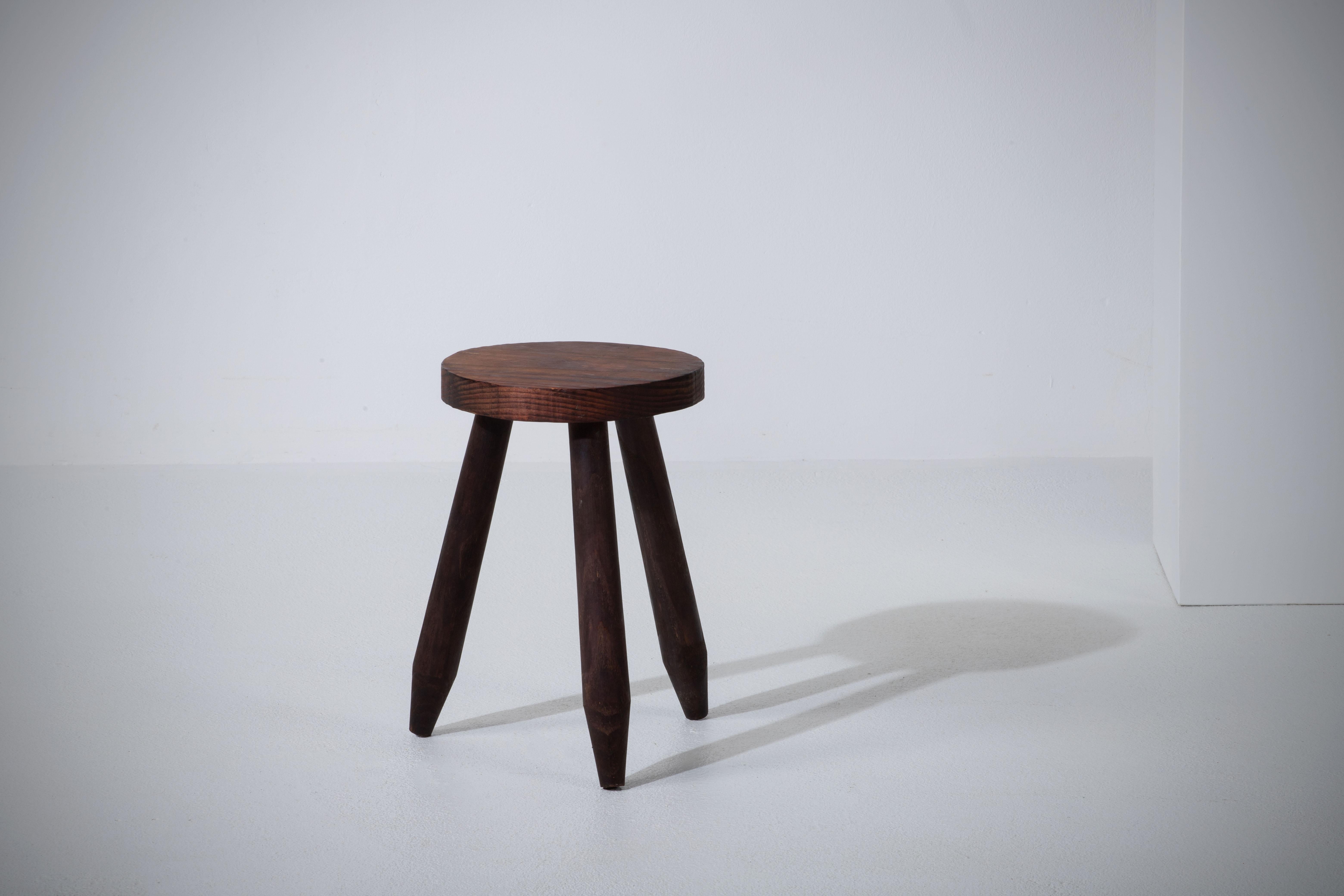 Fantastic wood stool from France in the style of Charlotte Perriand. Made in the 1960s with three legs. No hardware. Good vintage condition.