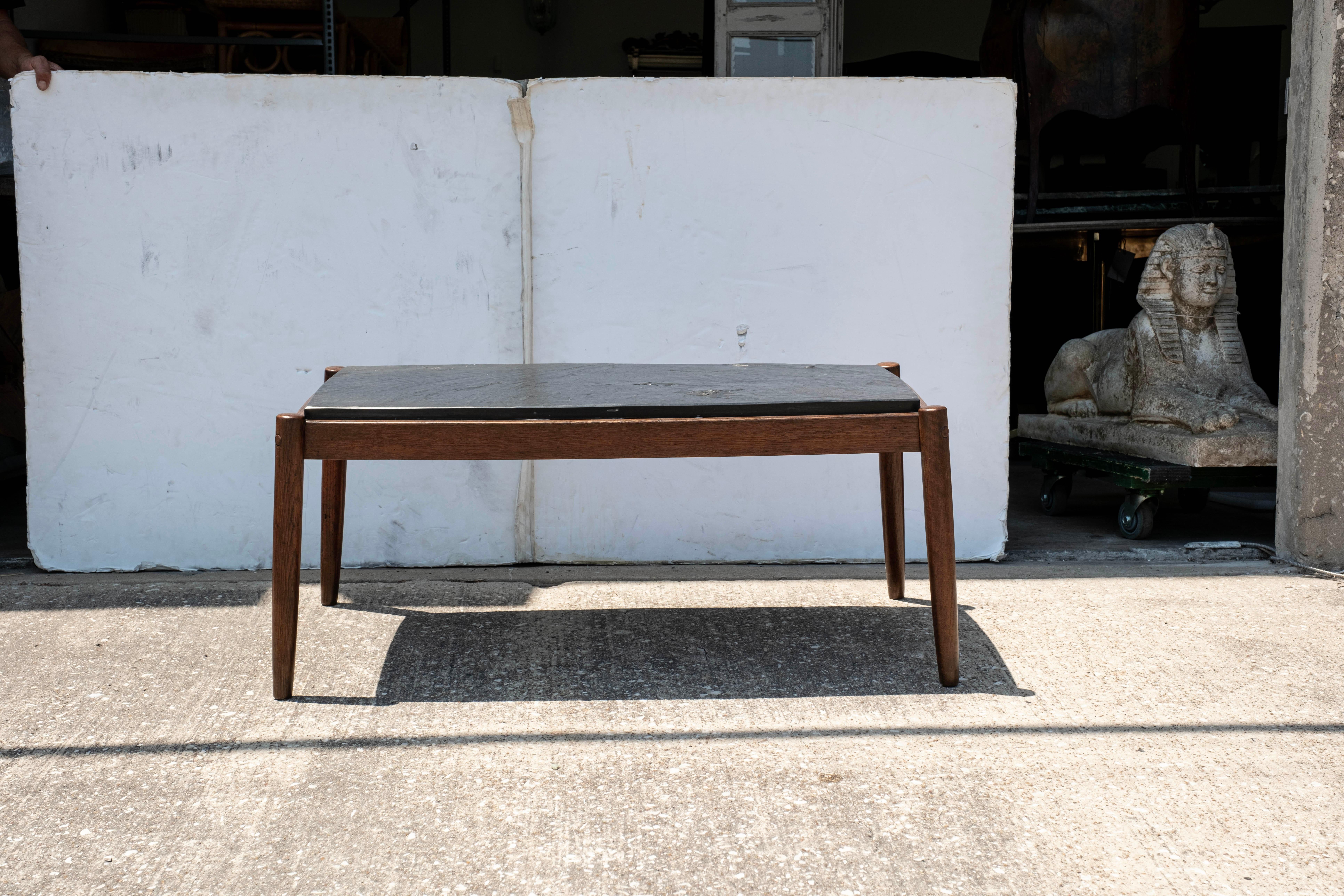 French Brutalist Walnut Coffee Table With Slate Top.
Our handsome French mid century Pierre Chapo style Brutalist rectangular cocktail table is stunning from every angle and will work in many different interiors.
Slate top is original to the table.