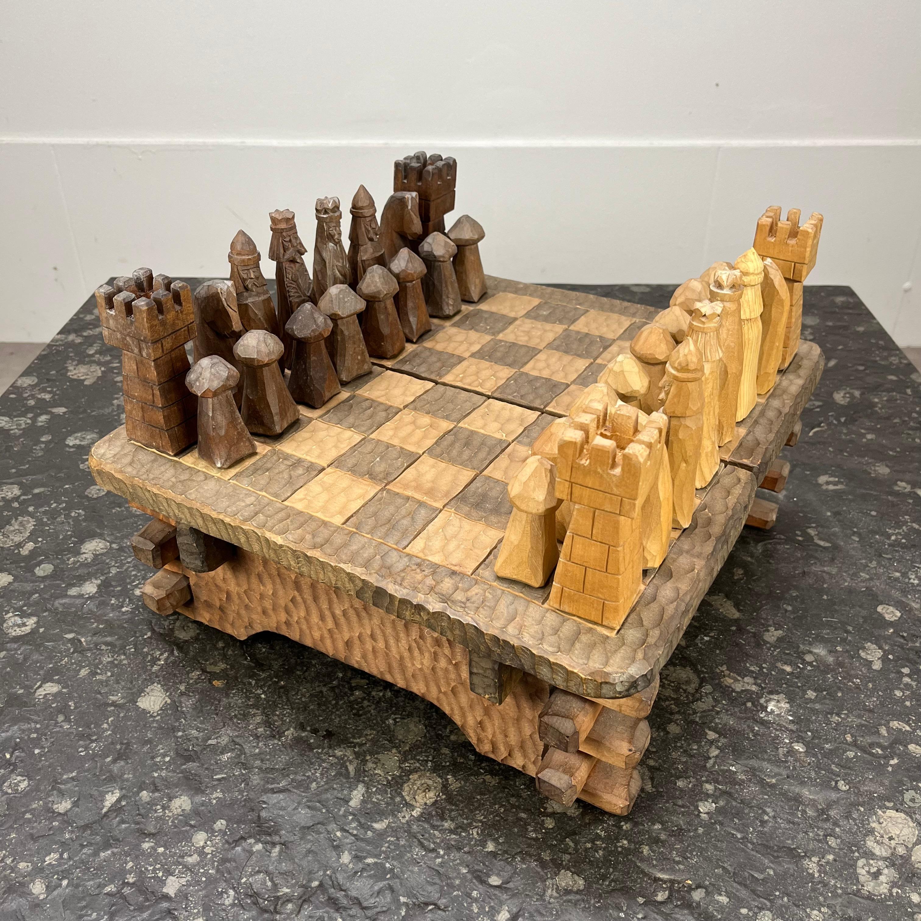 Rare one of a kind chessboard game, entirely made of handcarved wood, circa 1950. The singular brutalist design of this piece reminds us of the work of Jean Touret for Atelier Marolles. 