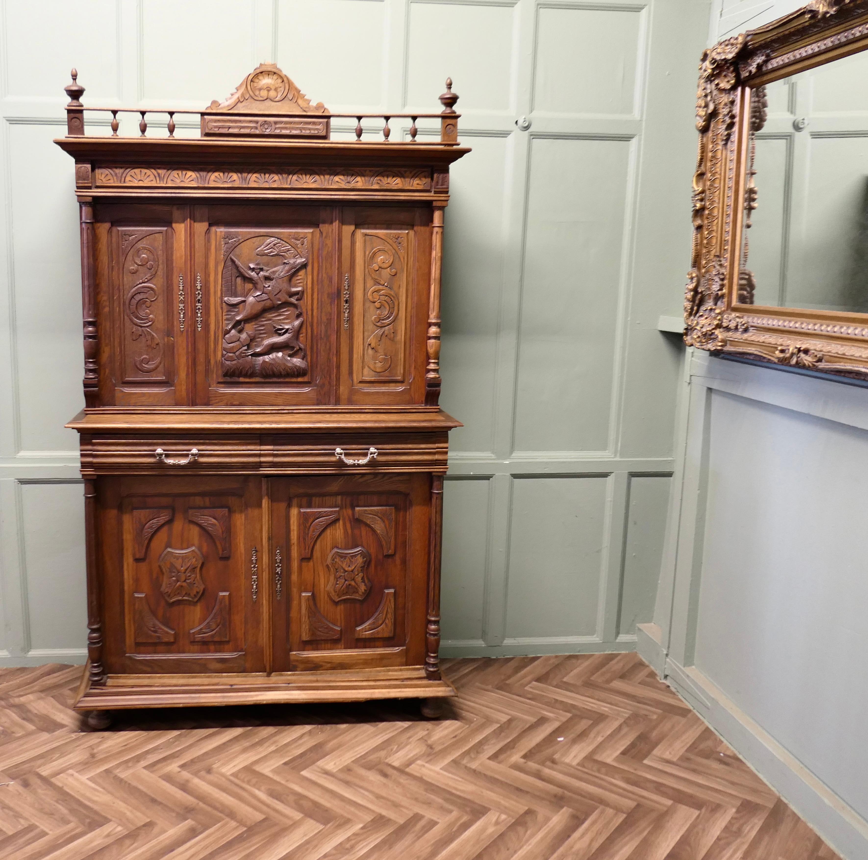 French Buffet de Corp, Carved Walnut Game Cupboard,

This is a French Buffet de Corp, or Carved Game Cupboard the upper section of the Cupboard has three doors enclosing a shelved cupboard beautifully carved with a hunting scene, the lower section