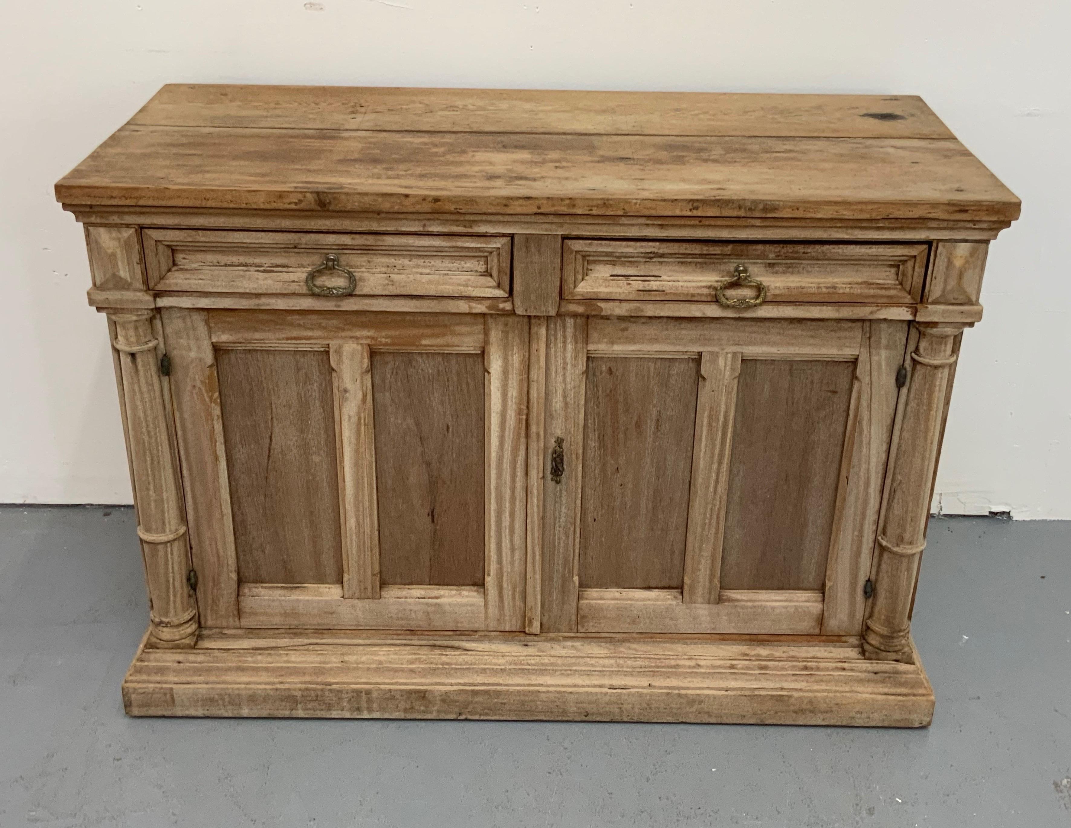 French antique buffet Empire Style, from 19th century with 2 drawers and 2 doors with made in walnut and with a bleached finish 

Lenght top of the piece 45 inch - Base of the piece 46
Depth top of the piece 19.25 inch - Base of the piece 19.5.